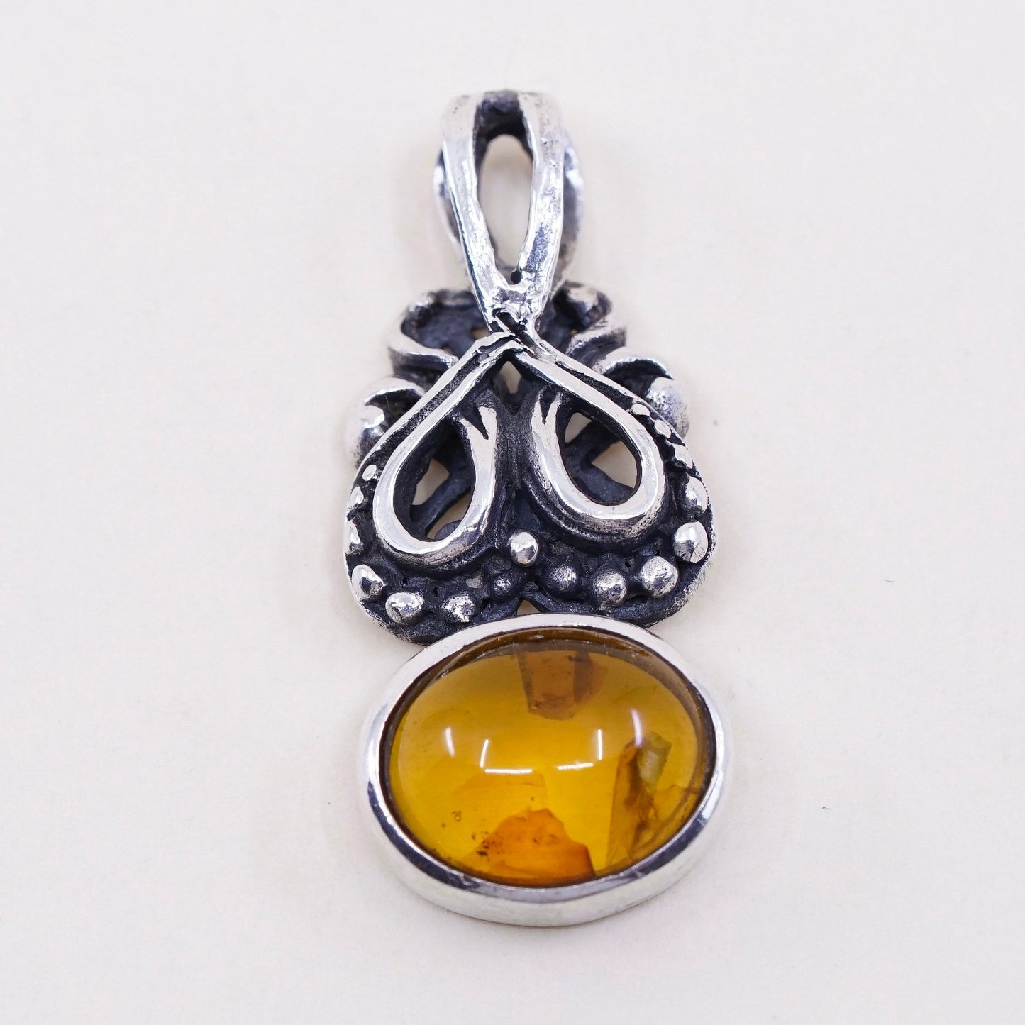 Vintage sterling 925 silver handmade pendant with oval amber and beads around