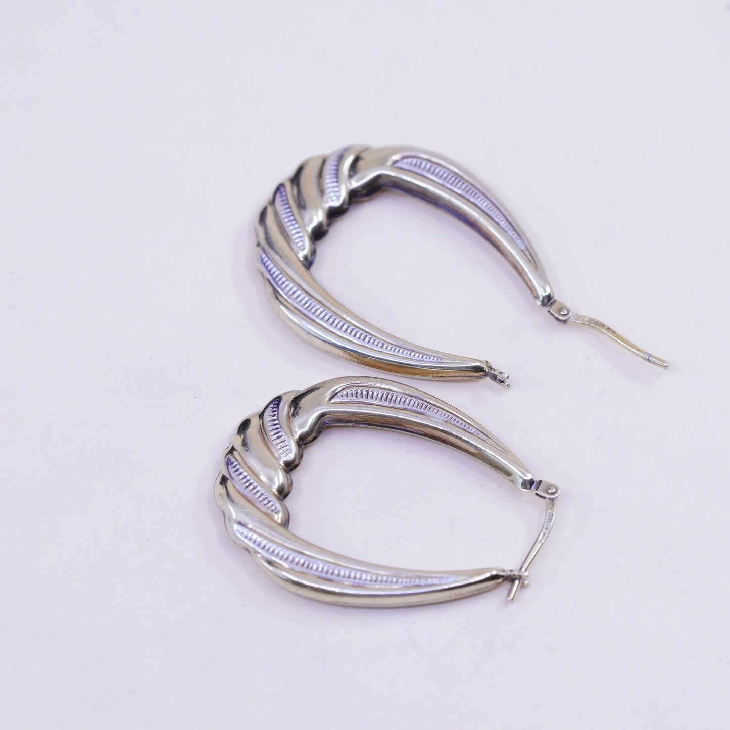 1.25”, two tone sterling silver loop earrings, Ribbed twisted hoops, huggie
