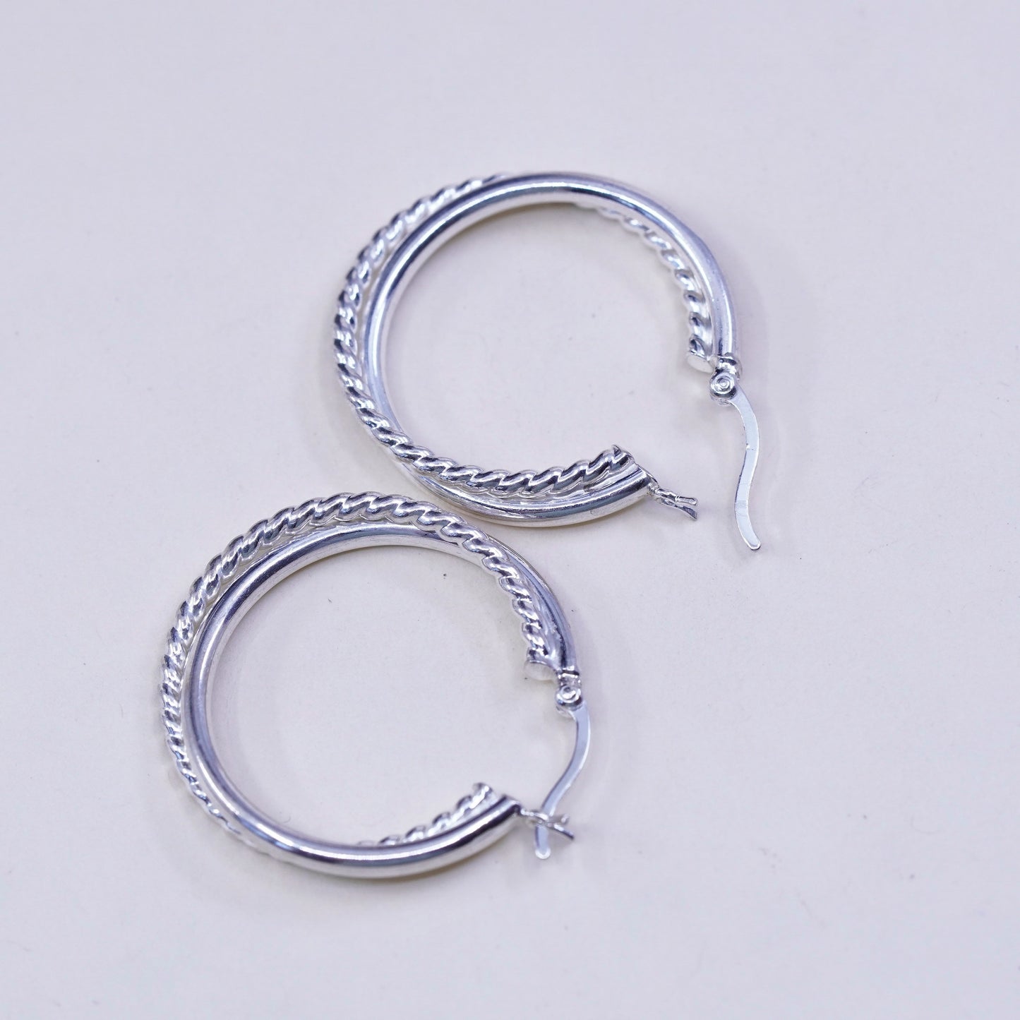 1.25”, Vintage sterling silver loop earrings, entwined twisted primitive hoops
