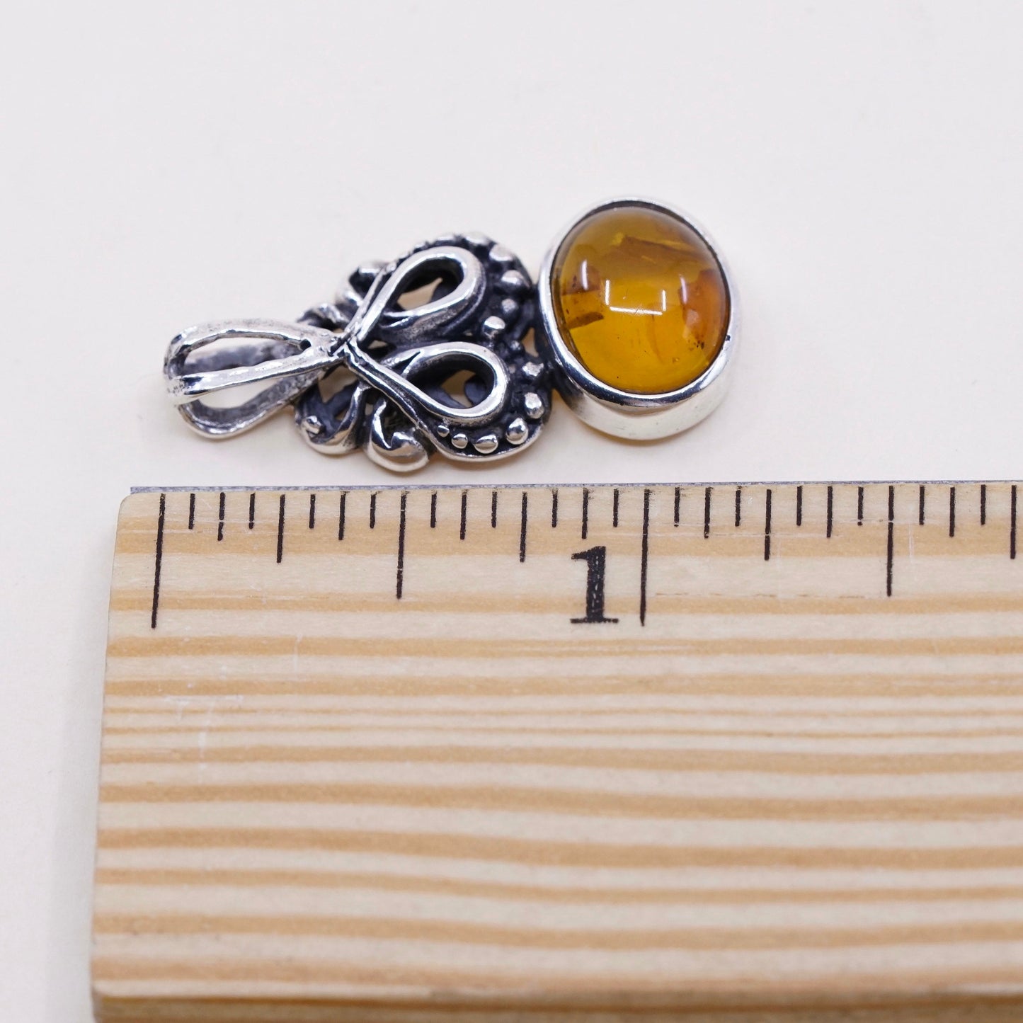 Vintage sterling 925 silver handmade pendant with oval amber and beads around