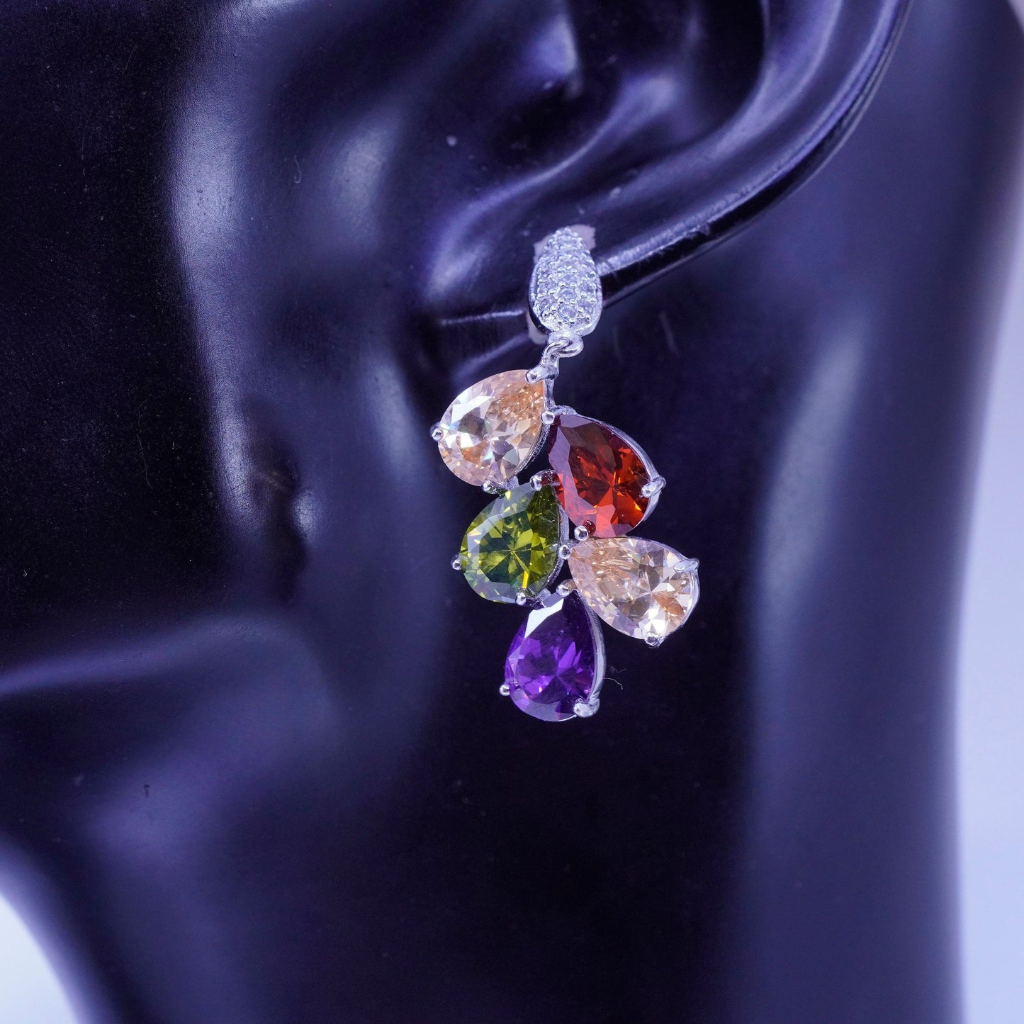 Silver tone earrings with teardrop colored cz