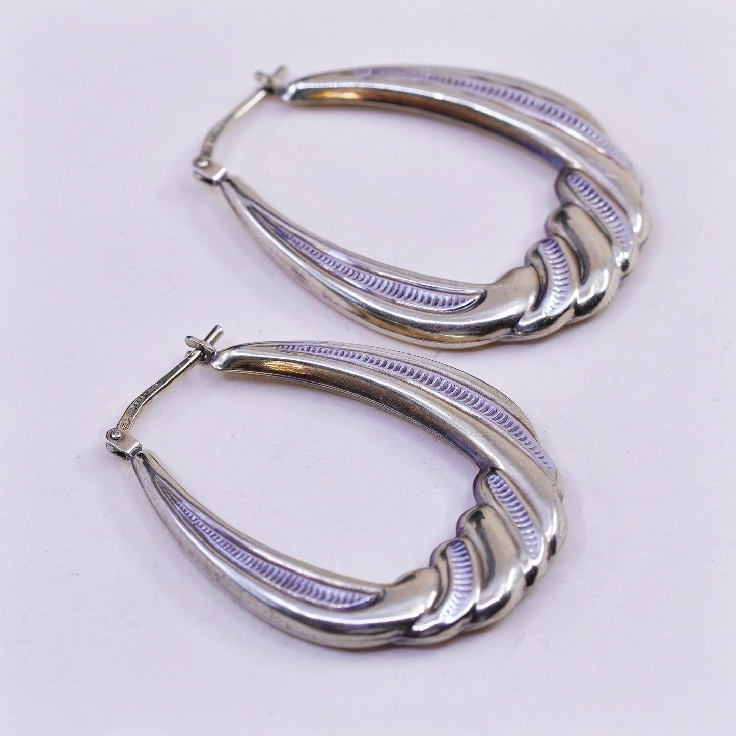 1.25”, two tone sterling silver loop earrings, Ribbed twisted hoops, huggie