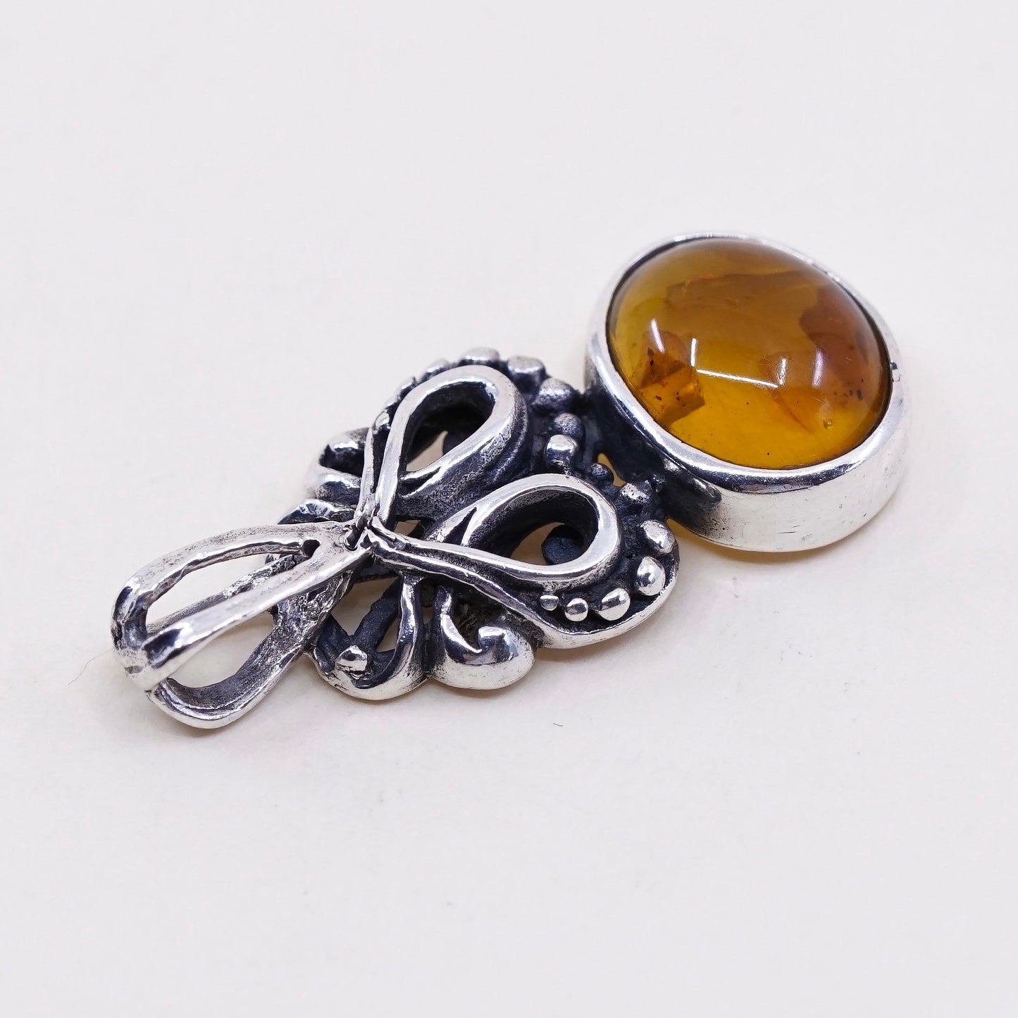 Vintage sterling 925 silver handmade pendant with oval amber and beads around