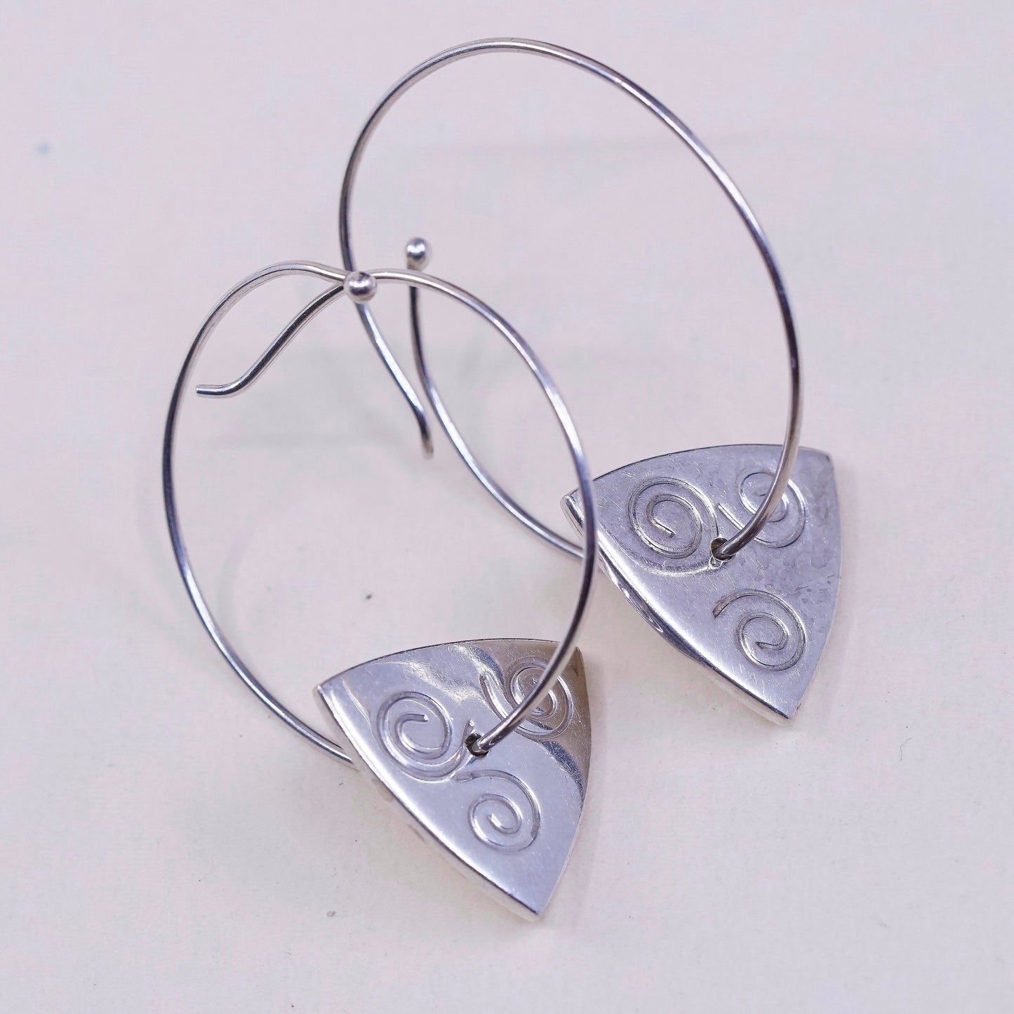 1.25”, vtg jeff gray sterling silver wrap hoops with swirl tag dangle, earrings