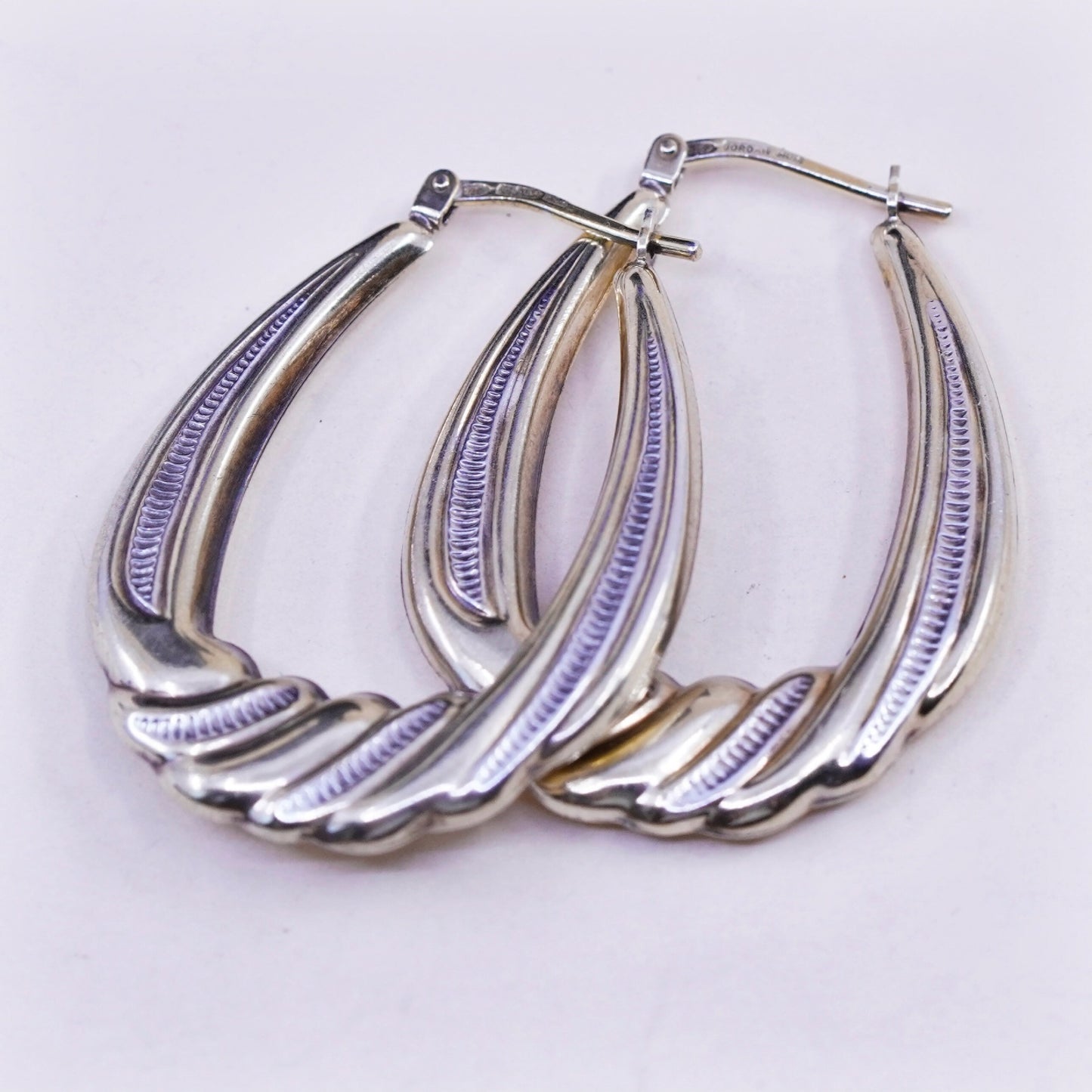 1.25”, two tone sterling silver loop earrings, Ribbed twisted hoops, huggie