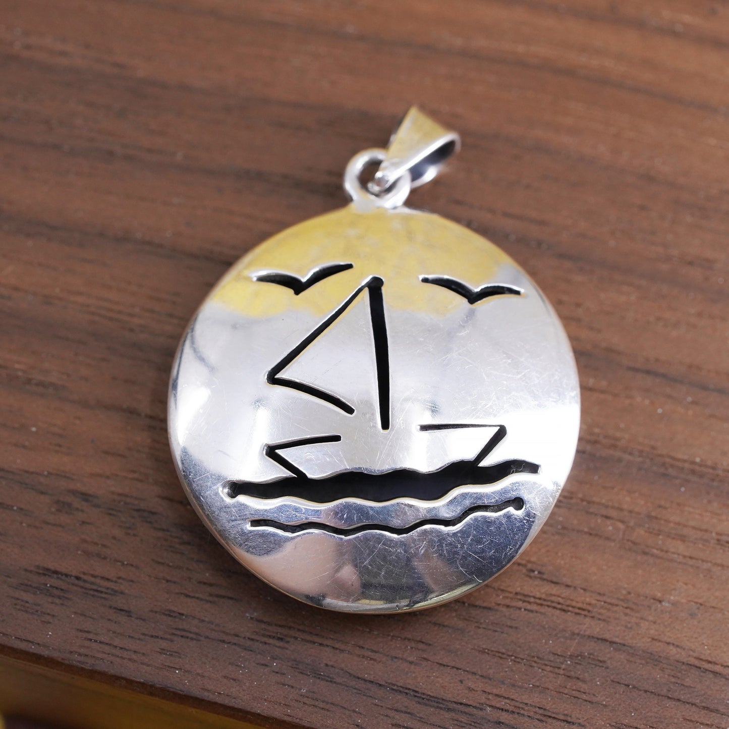 Sterling silver handmade pendant, puffy 925 circle with sailing boat cut out