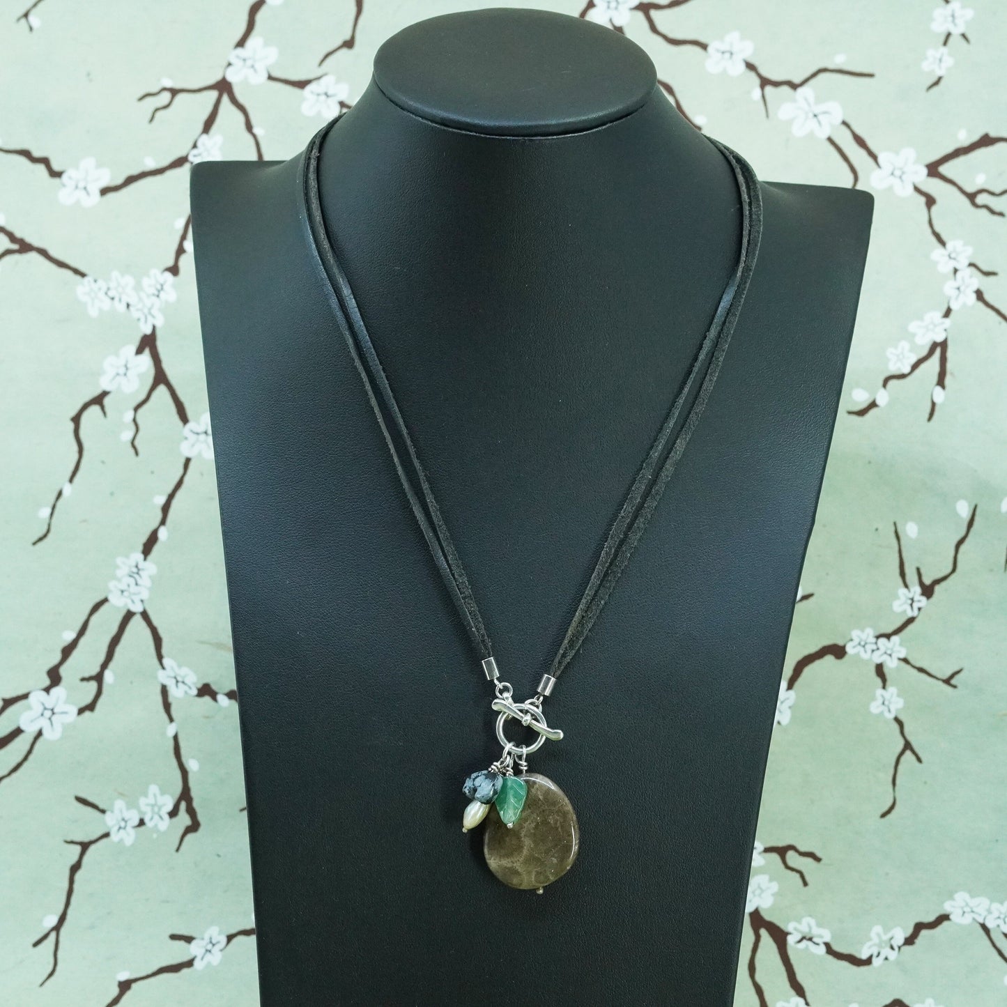 18”, Native American leather necklace with fossil coral pendant, jade leaf