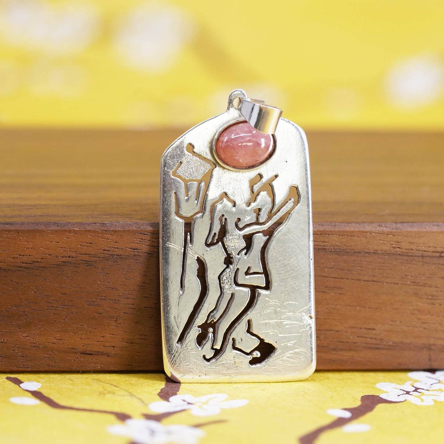 Sterling silver pendant, 925 tag with dancing couple cut out and pink quartz