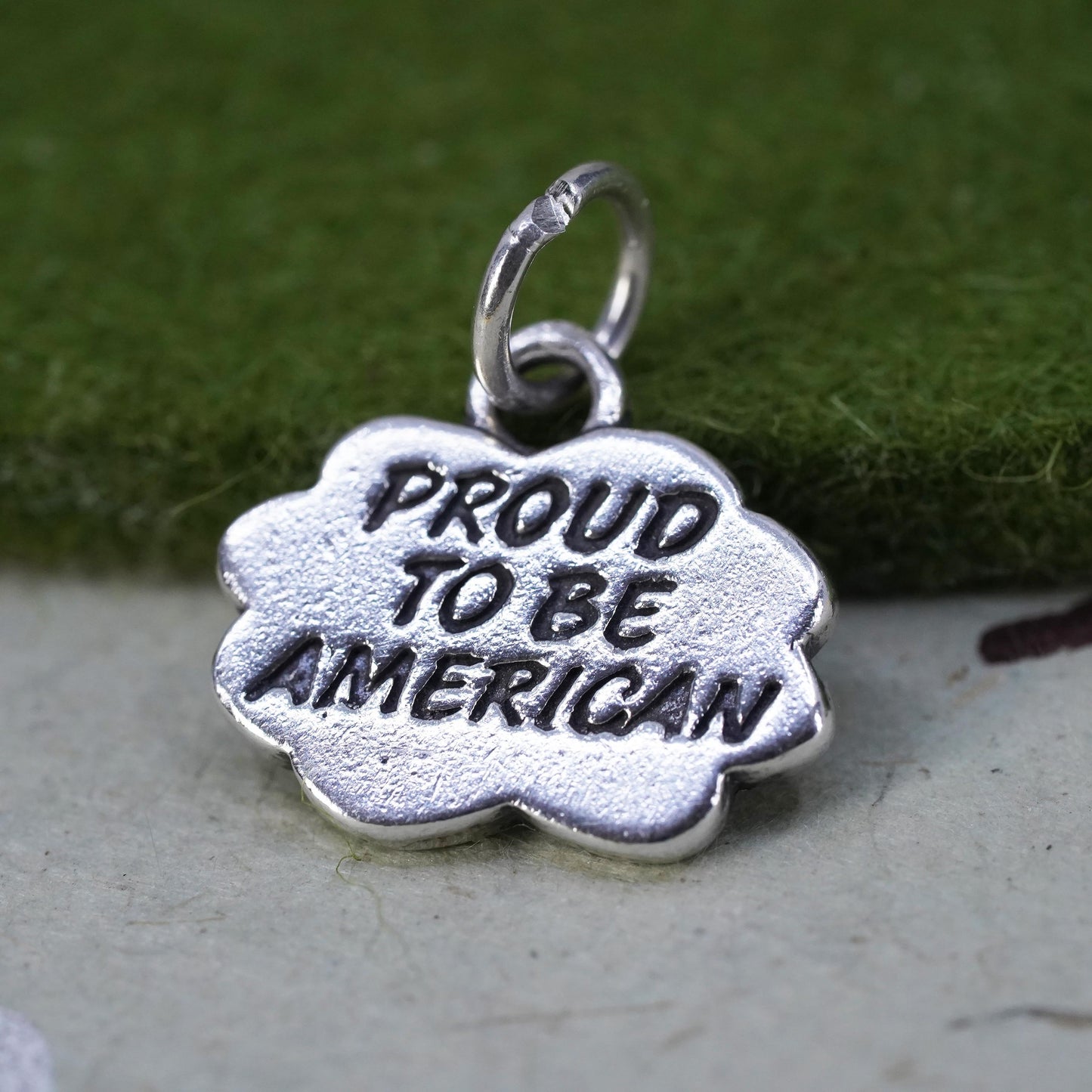 Vintage sterling silver charm, 925 tag pendant embossed "proud to be American"