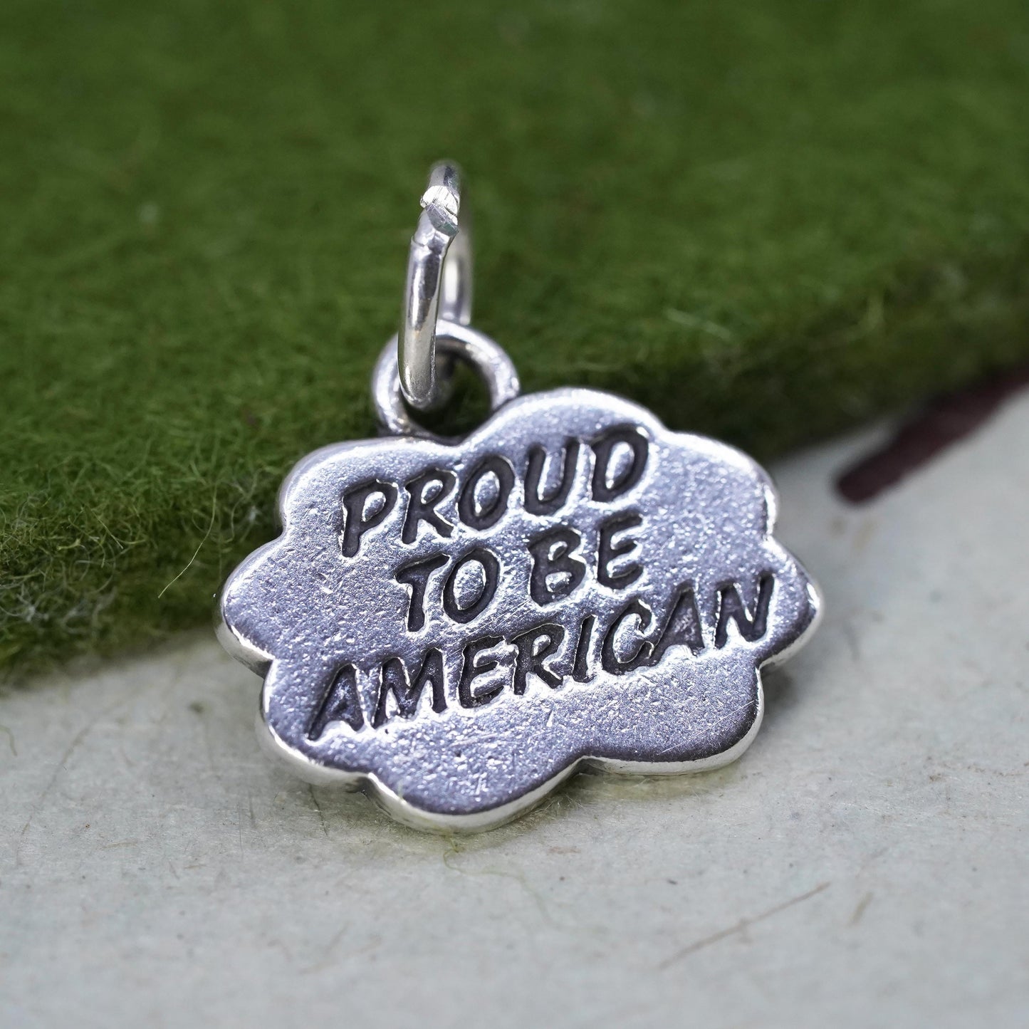 Vintage sterling silver charm, 925 tag pendant embossed "proud to be American"