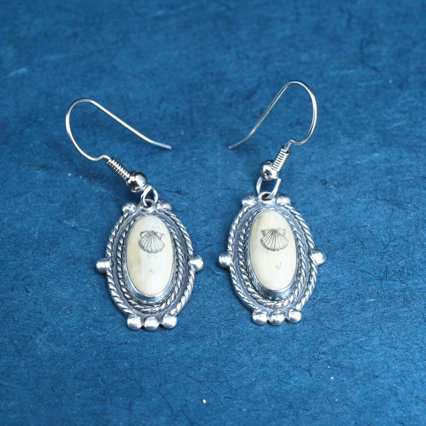 Vintage southwestern sterling silver handmade earrings with carved seed dangles