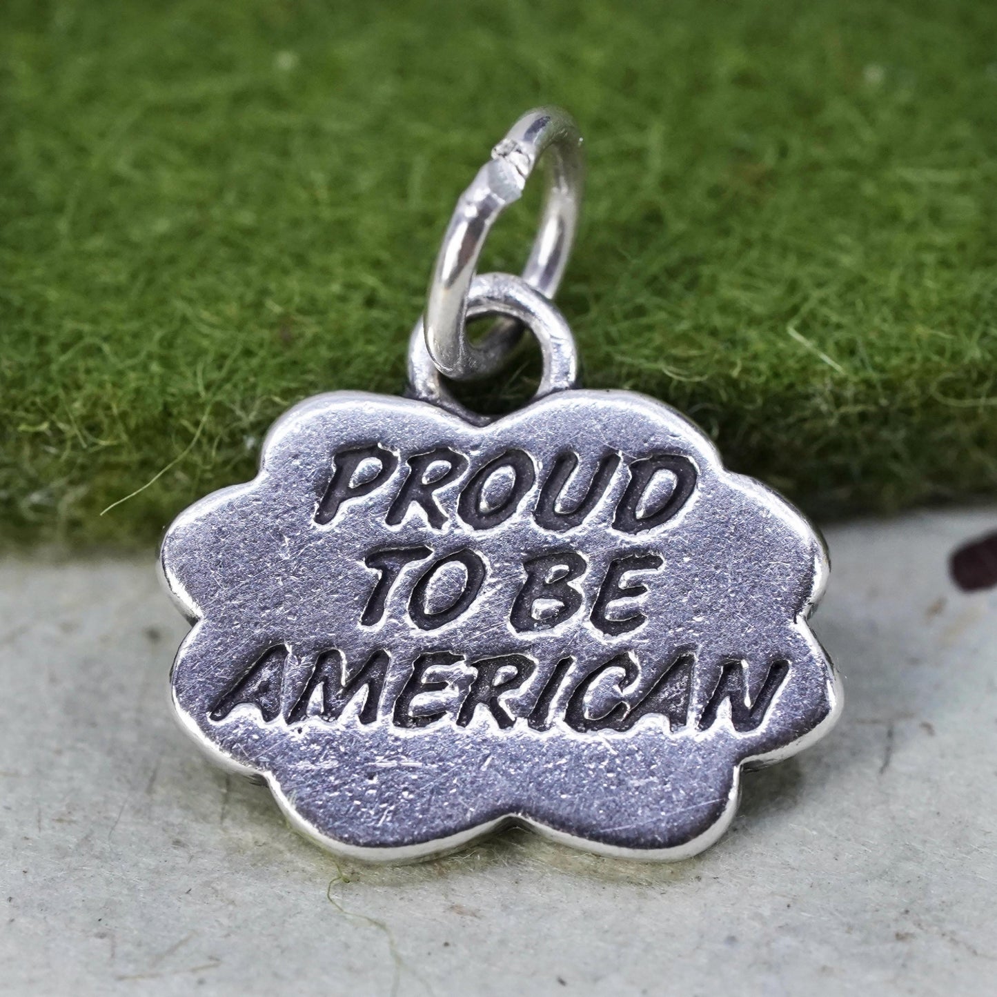 Vintage sterling silver charm, 925 tag pendant embossed "proud to be American"