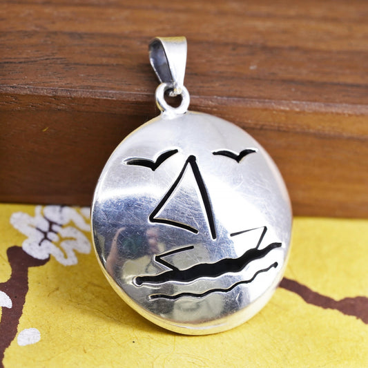 Sterling silver handmade pendant, puffy 925 circle with sailing boat cut out