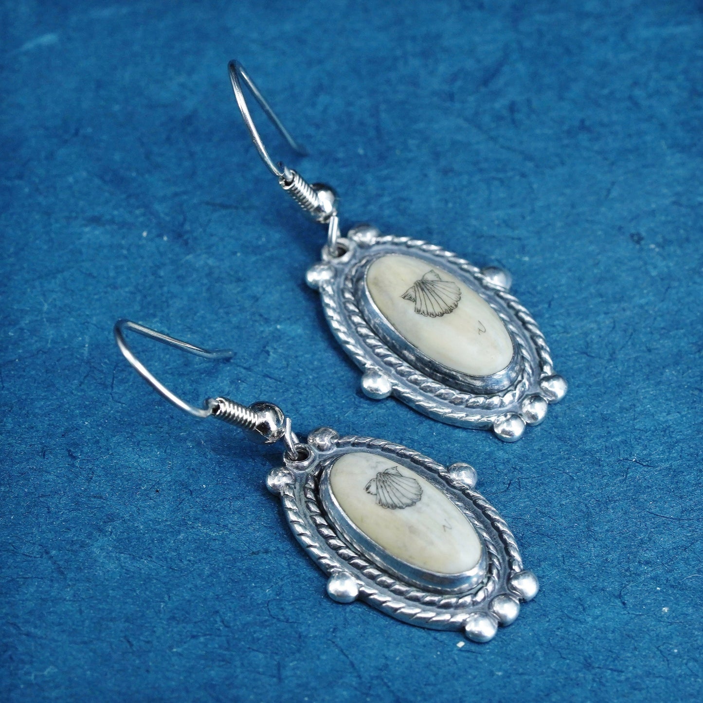 Vintage southwestern sterling silver handmade earrings with carved seed dangles