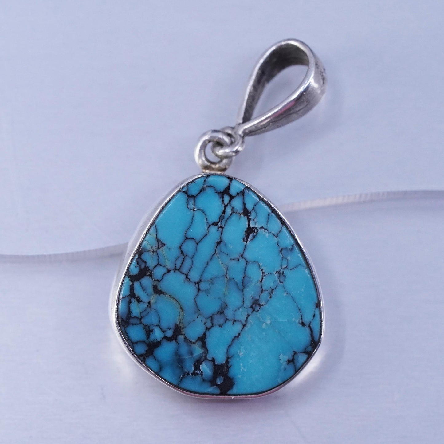 southwestern sterling 925 silver pendant with kingman spiderwebbed turquoise