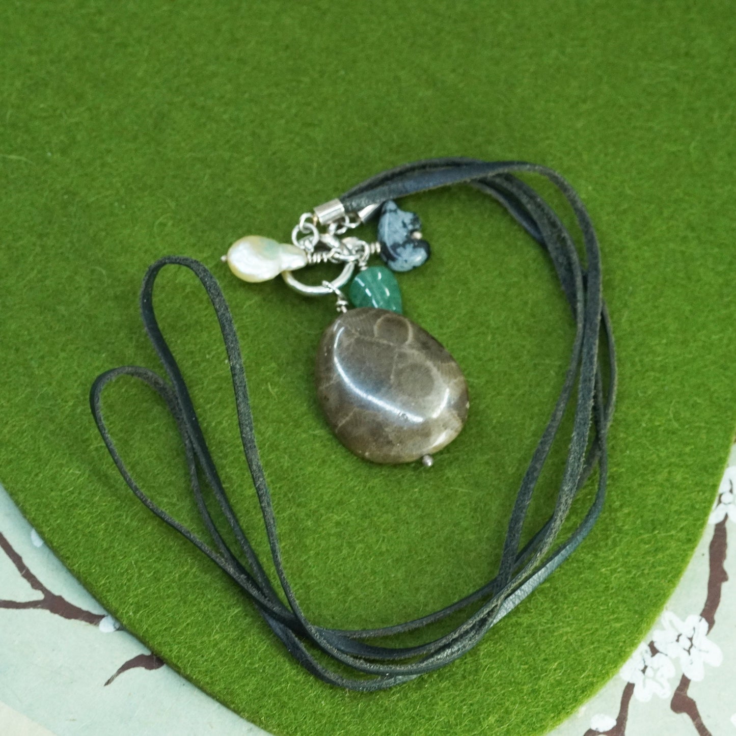 18”, Native American leather necklace with fossil coral pendant, jade leaf