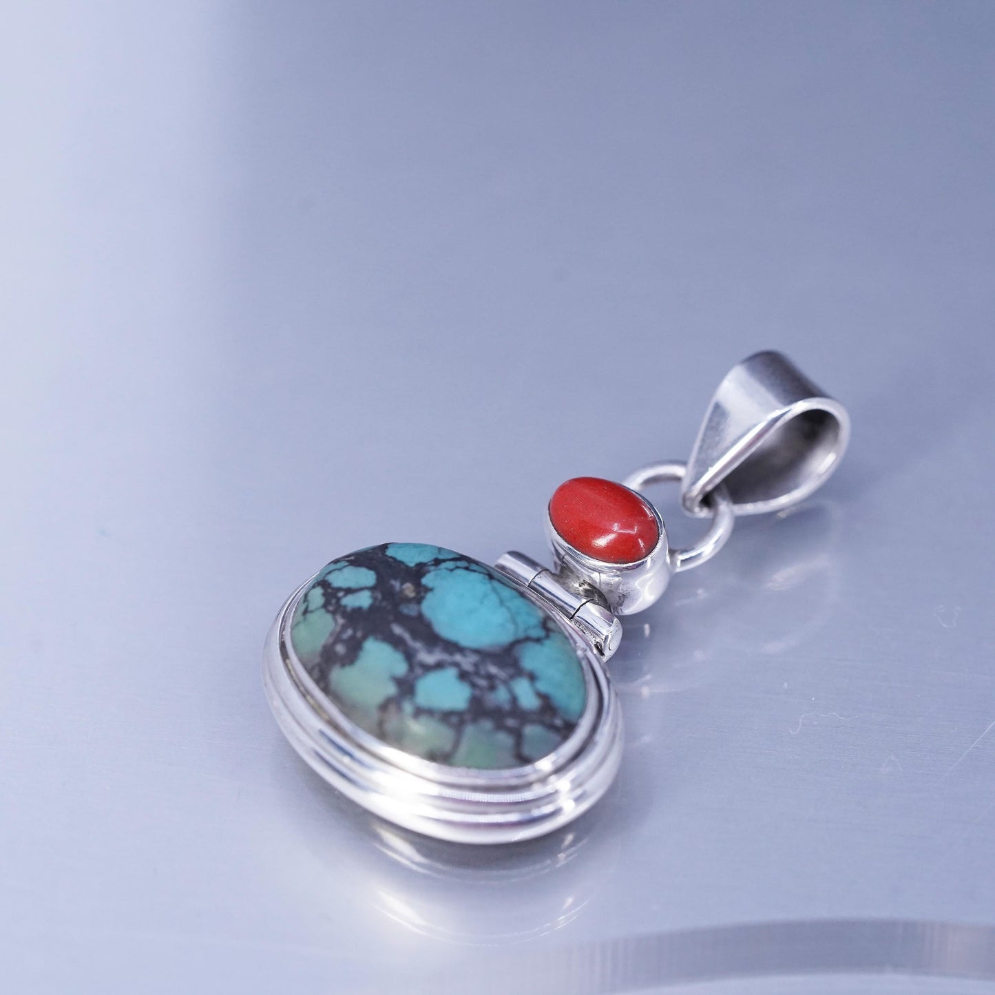 Native American sterling 925 silver pendant with spiderwebbed turquoise coral