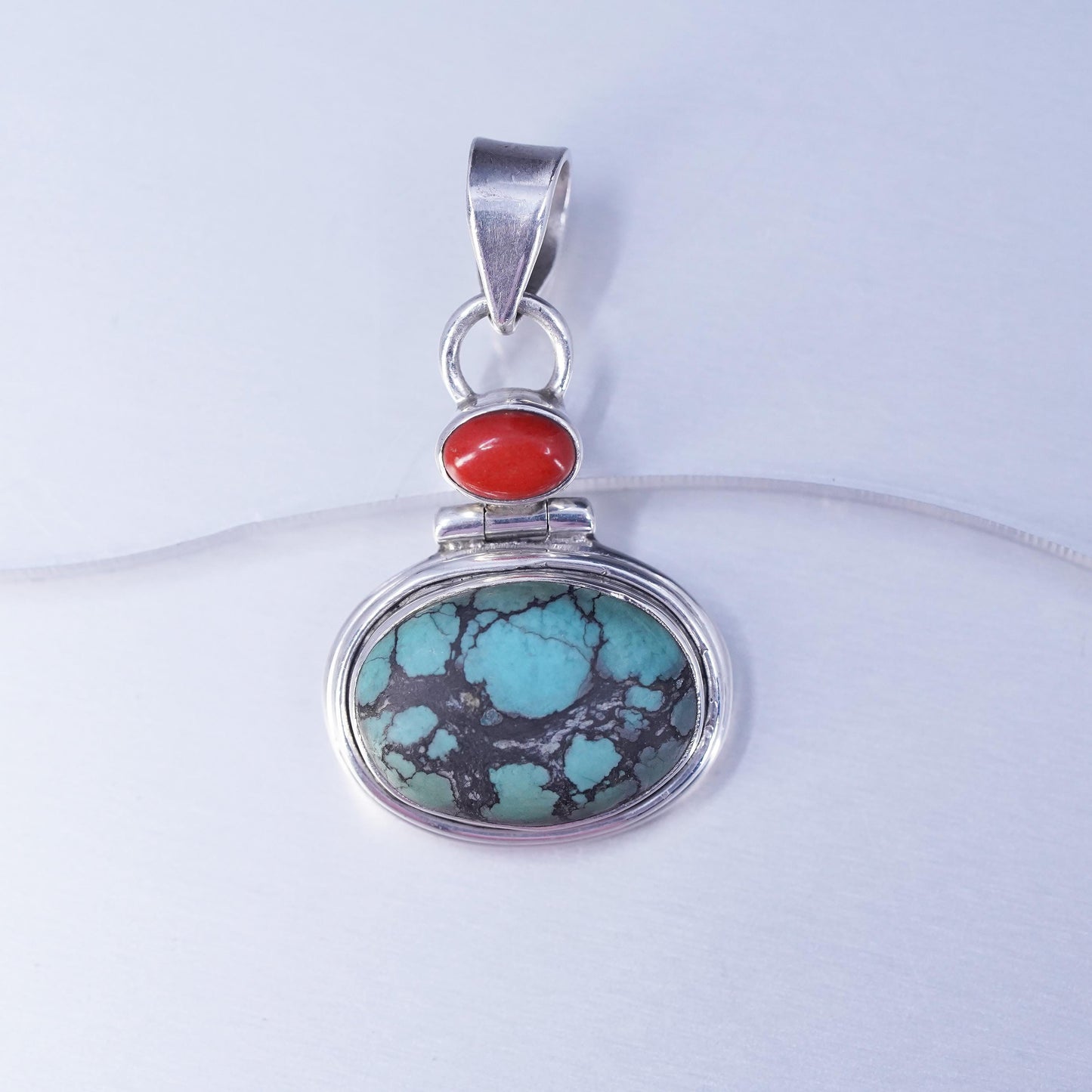 Native American sterling 925 silver pendant with spiderwebbed turquoise coral