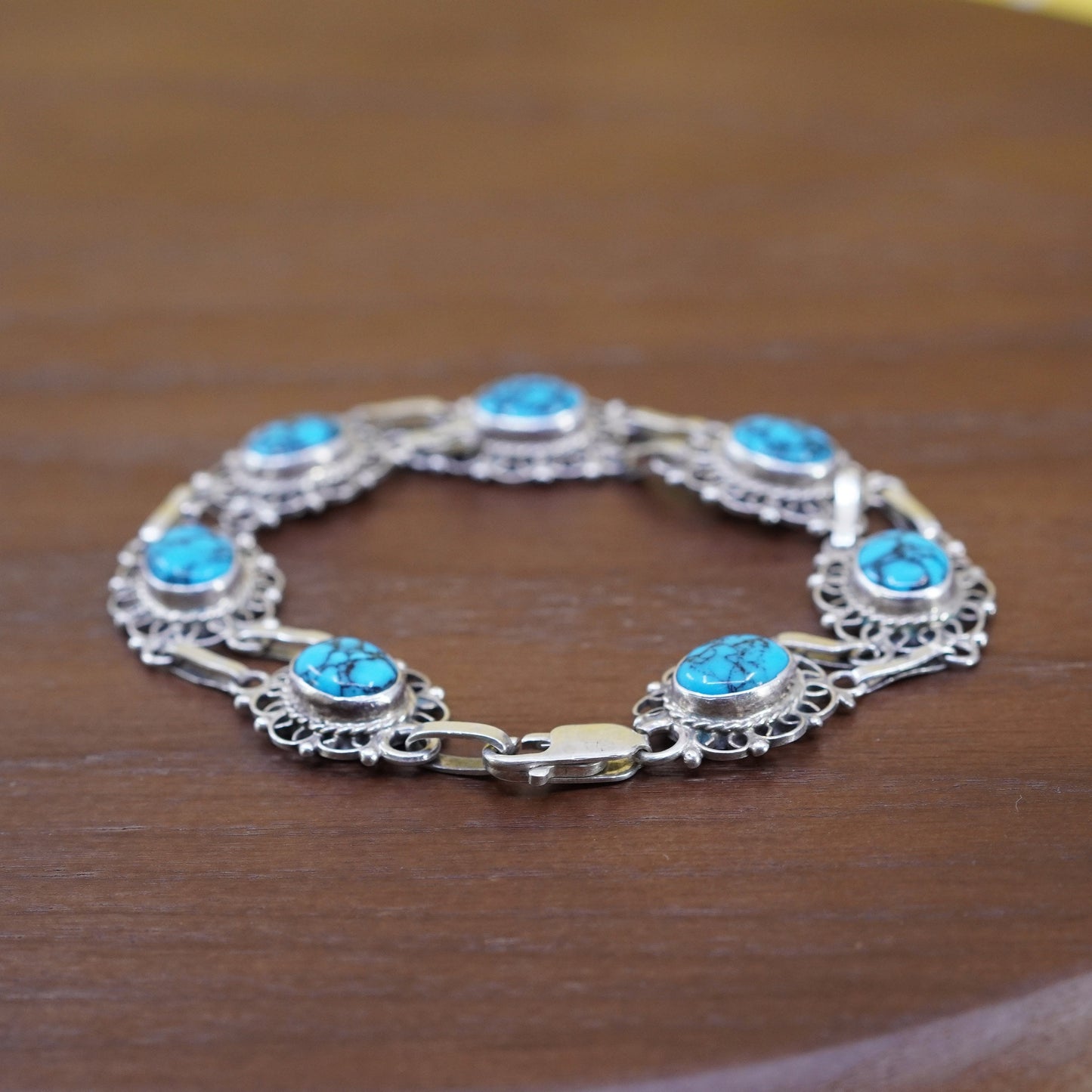 7.75”, mexico Sterling 925 silver filigree bracelet with spiderwebbed turquoise