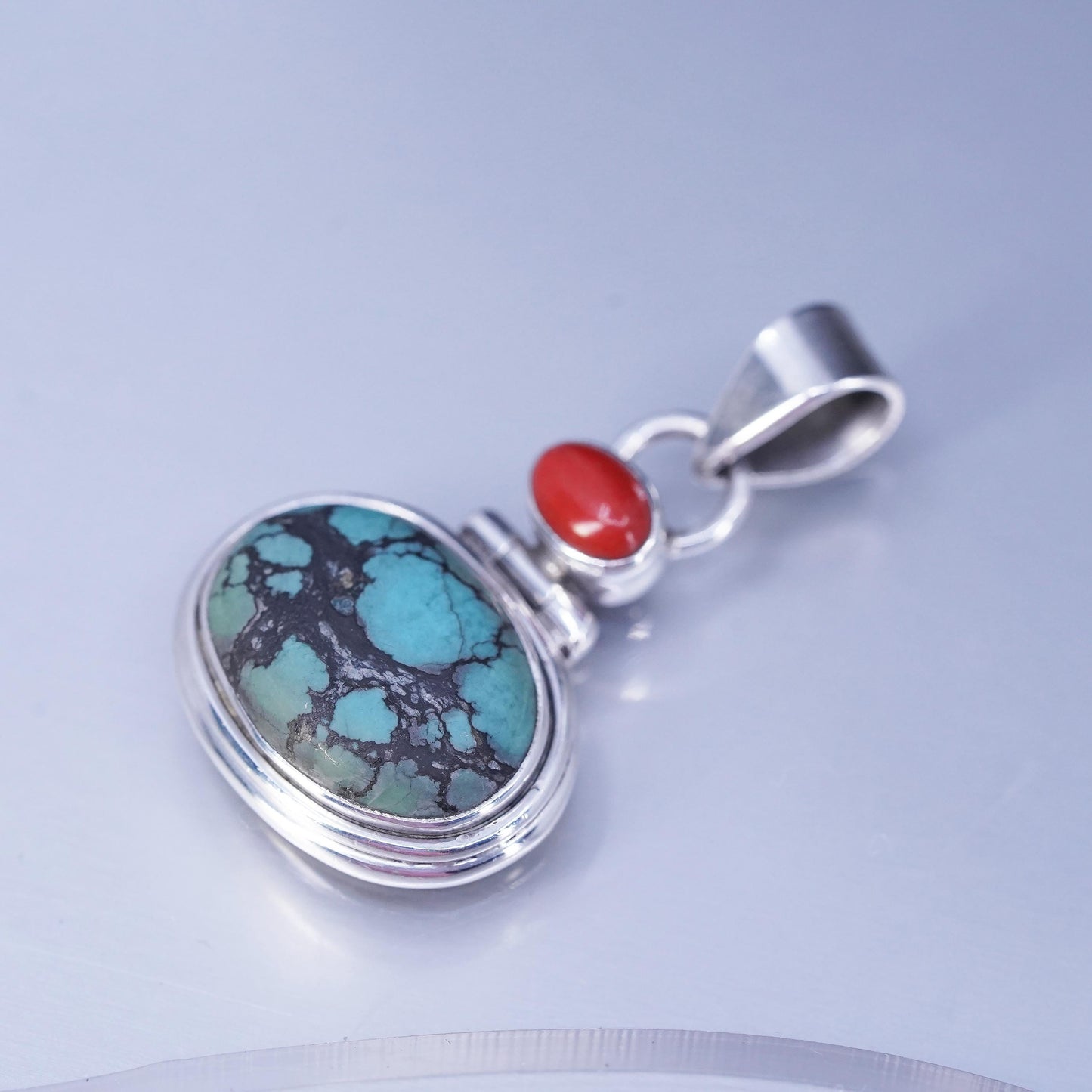 Native American sterling 925 silver pendant with spiderwebbed turquoise coral