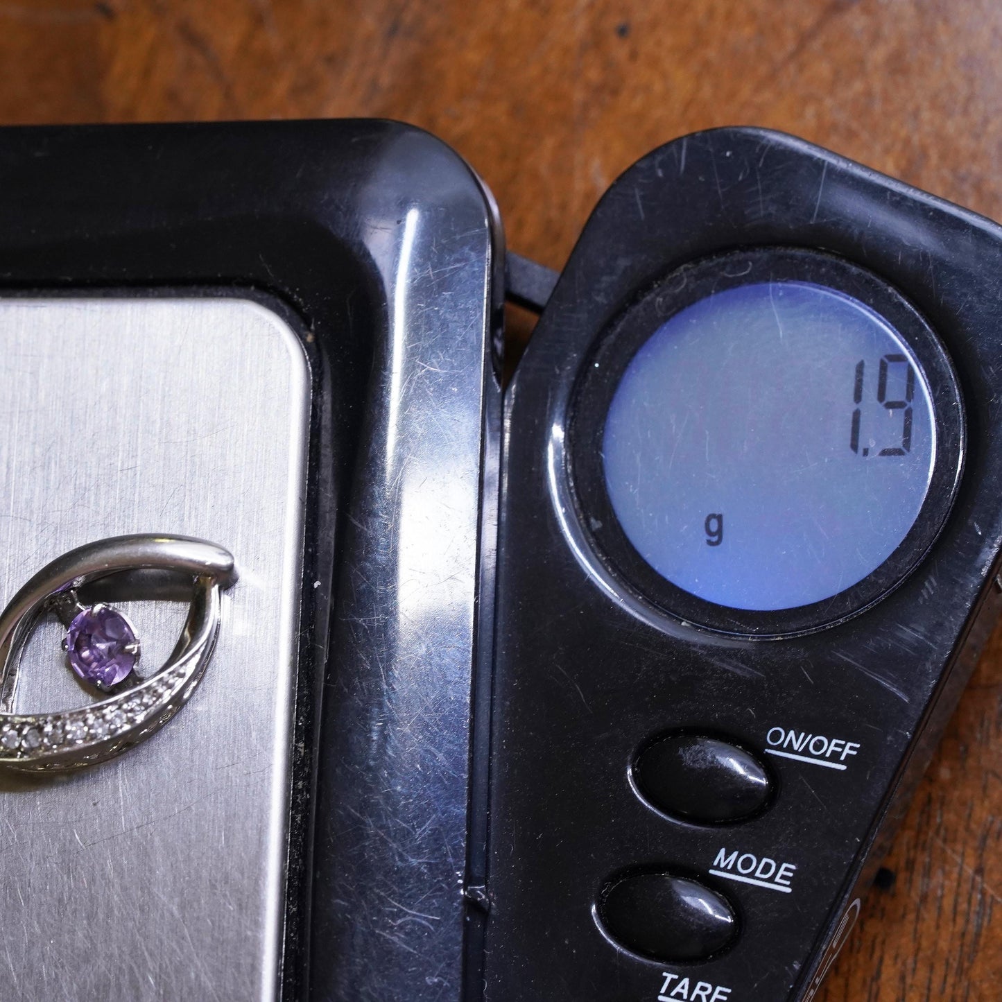 Vintage sterling 925 silver pendant with dancing amethyst and cz around