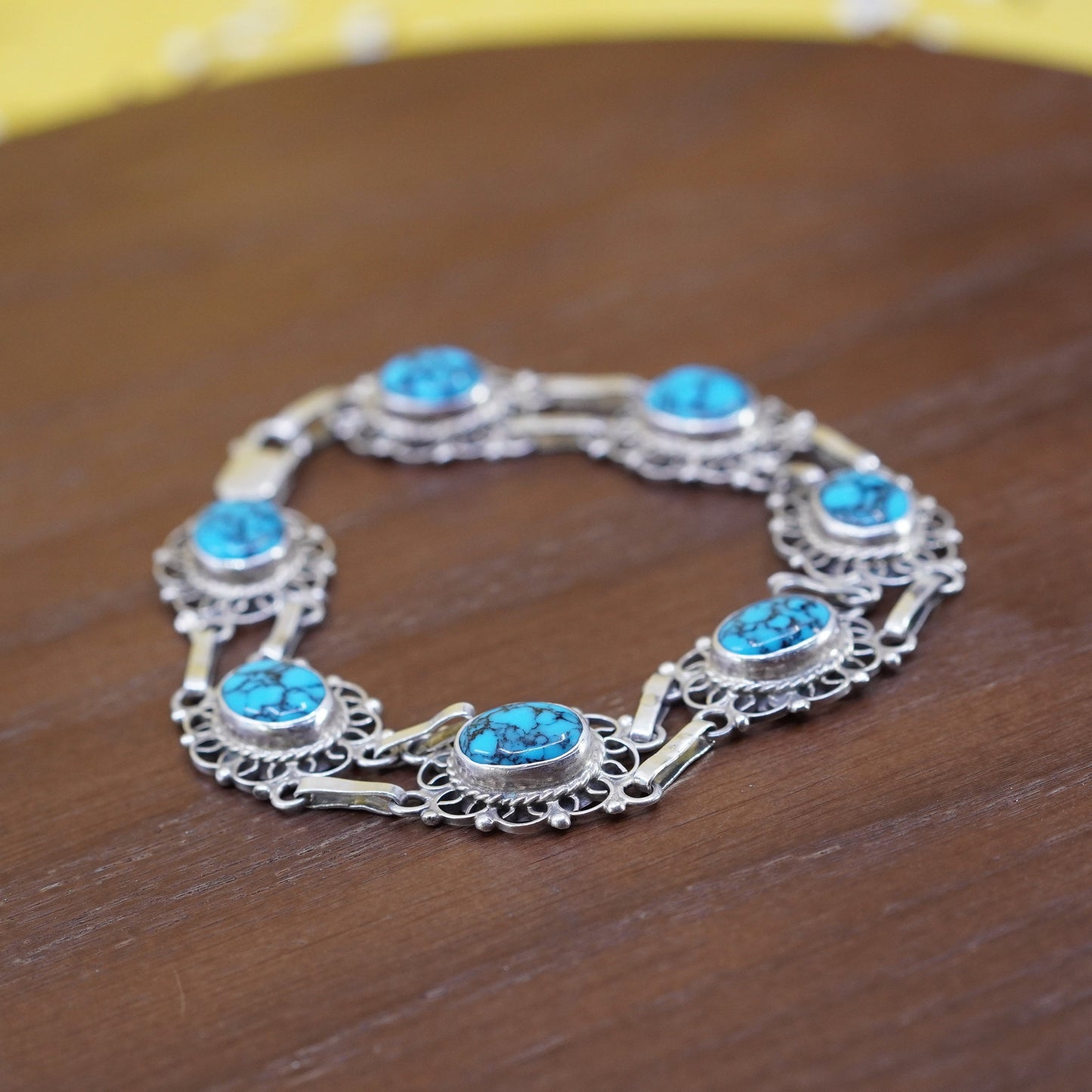 7.75”, mexico Sterling 925 silver filigree bracelet with spiderwebbed turquoise