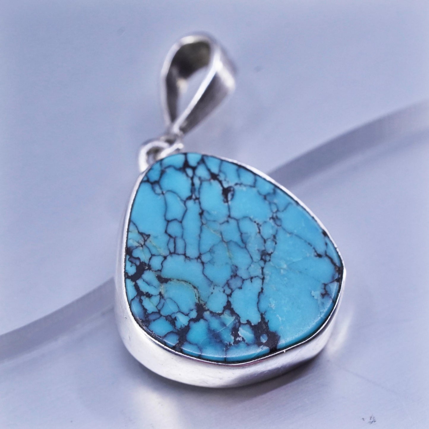 southwestern sterling 925 silver pendant with kingman spiderwebbed turquoise