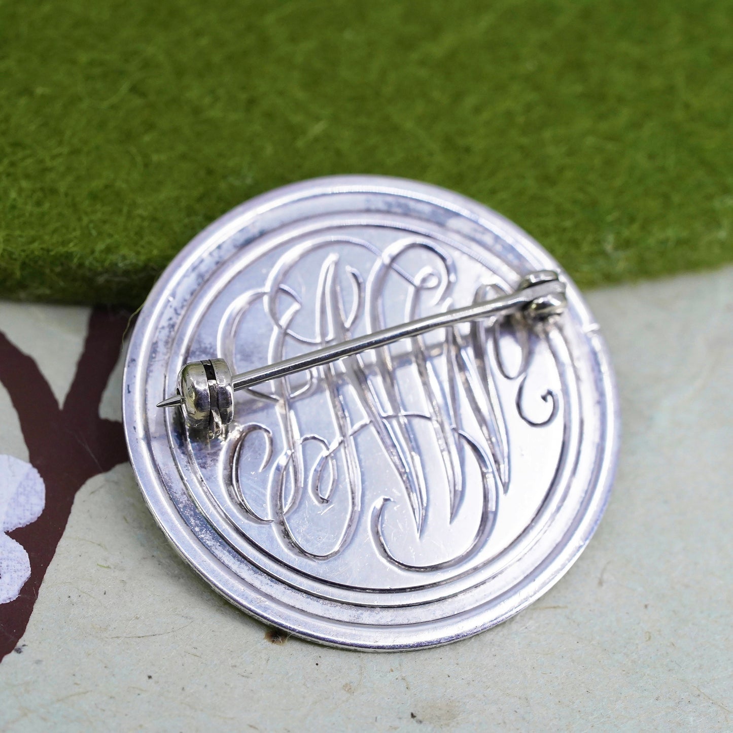 Vintage sterling silver handmade brooch, round tag with name monogram "GCCV"