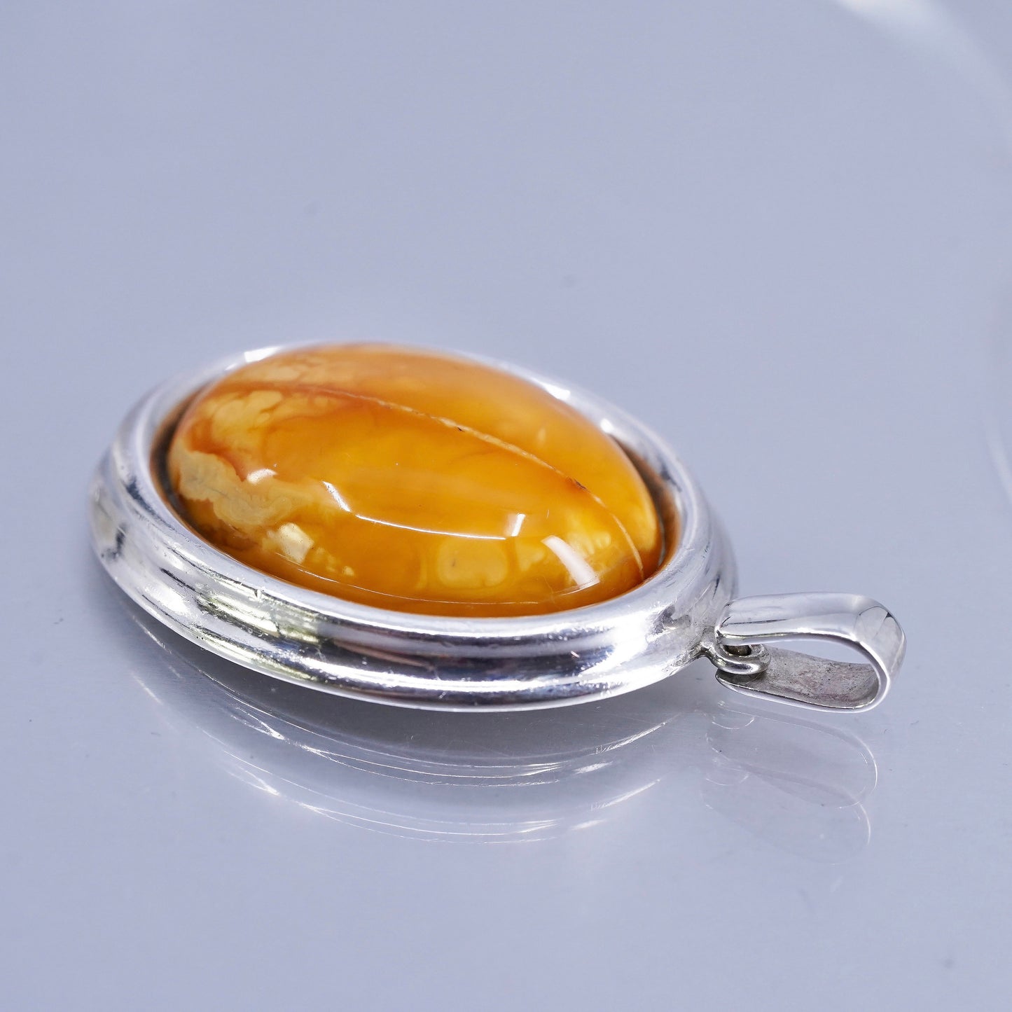 Vintage sterling 925 silver handmade pendant with oval amber