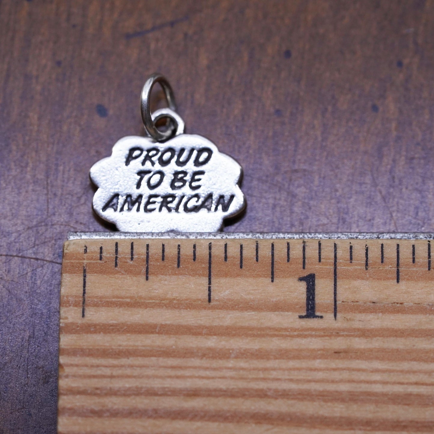 Vintage sterling silver charm, 925 tag pendant embossed "proud to be American"