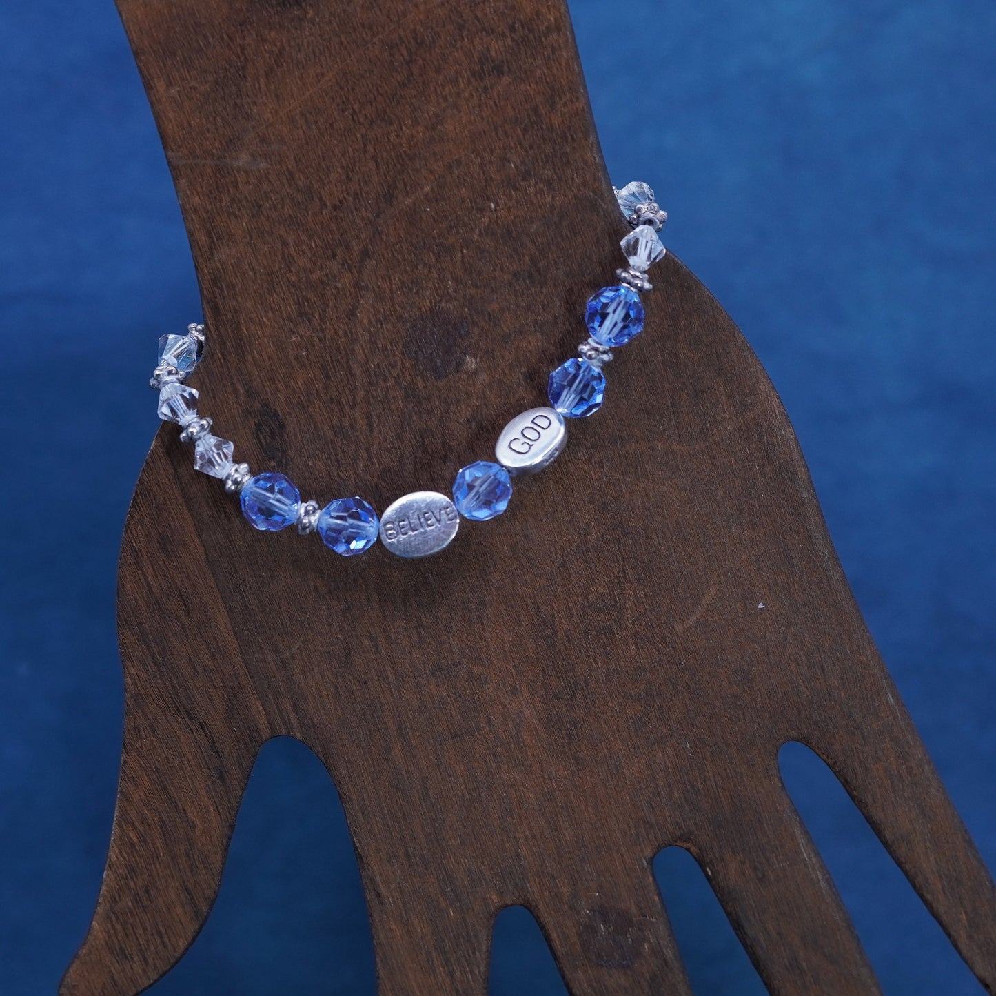 6.75”, Sterling 925 silver bracelet with blue crystal and believe god charms