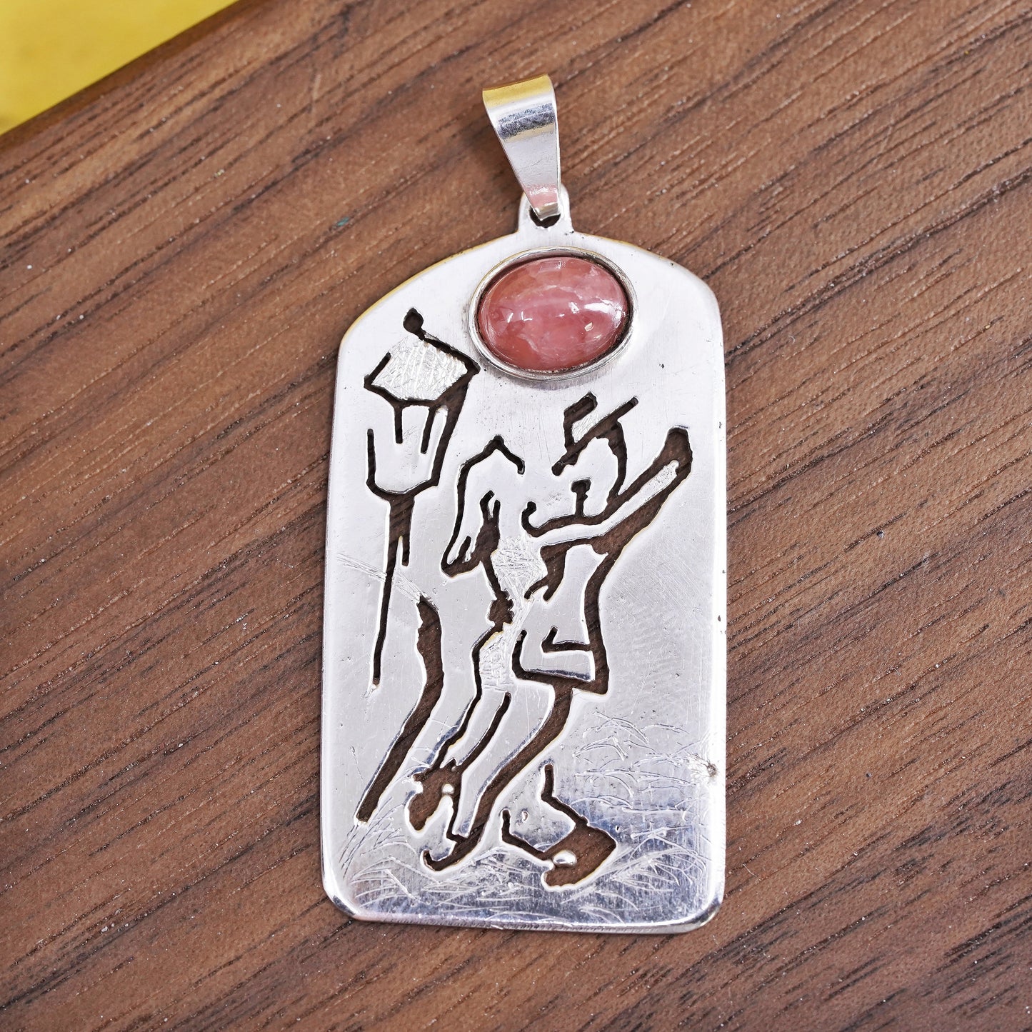 Sterling silver pendant, 925 tag with dancing couple cut out and pink quartz