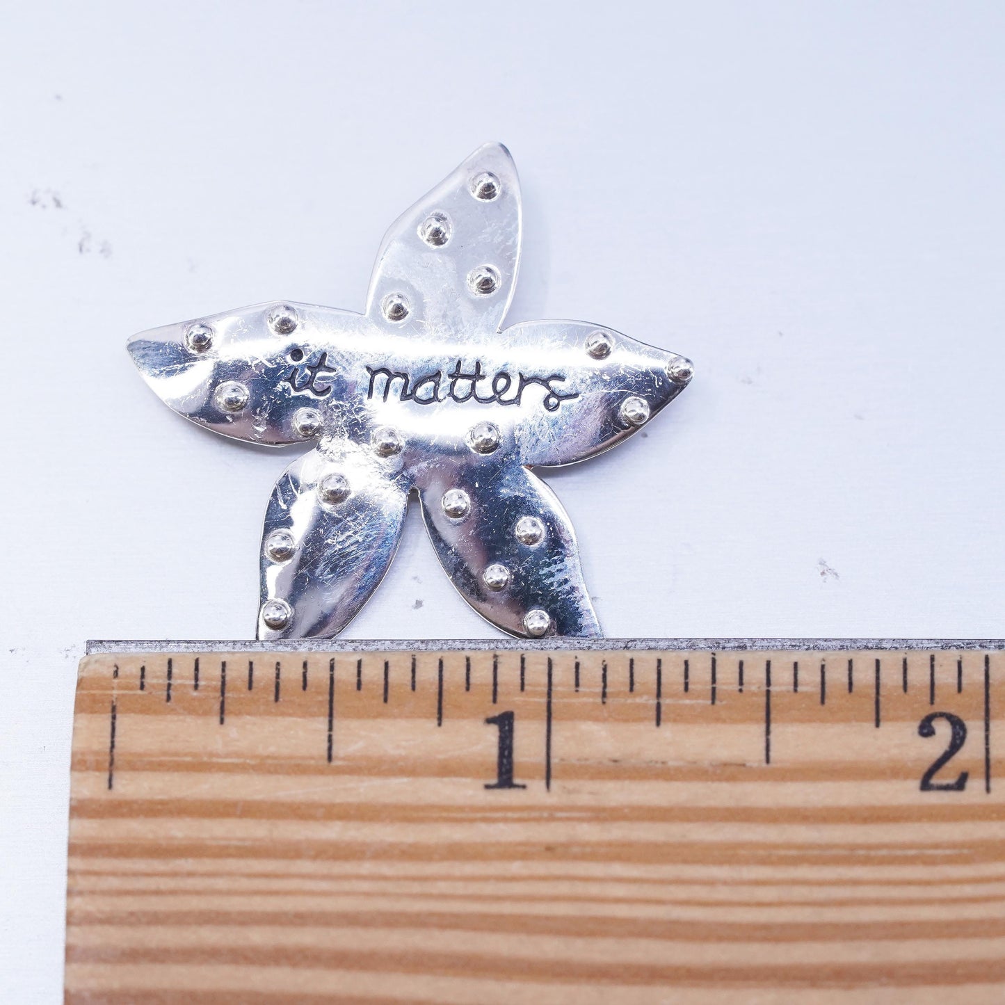 Baroni sterling silver brooch, 925 star starfish pin embossed “it matters”