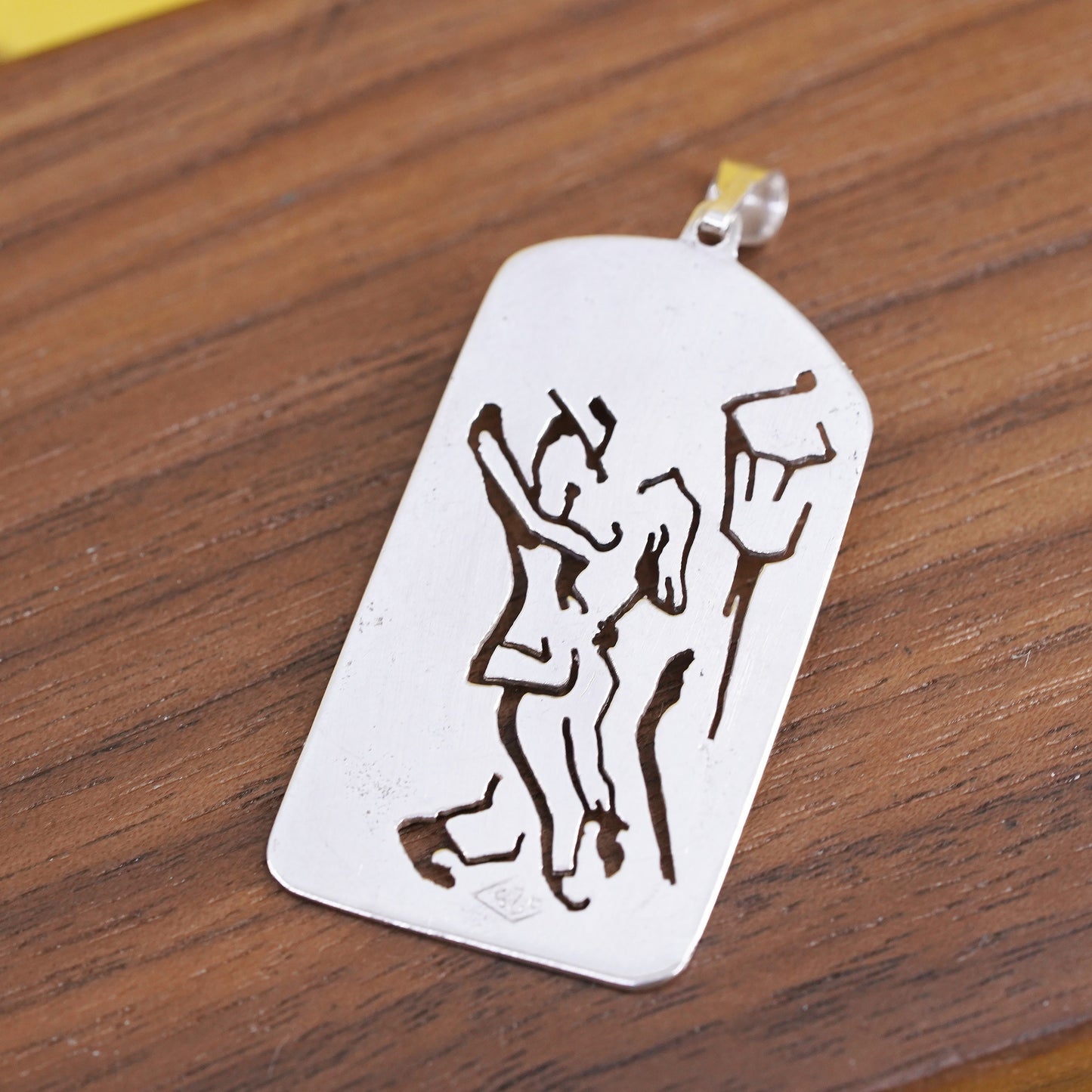 Sterling silver pendant, 925 tag with dancing couple cut out and pink quartz