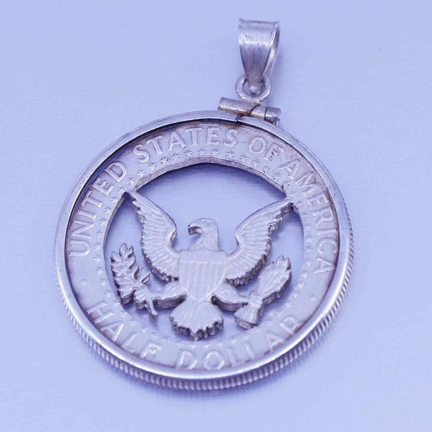 Antique 1964 Sterling 925 silver half dollar coin pendant with eagle cut out