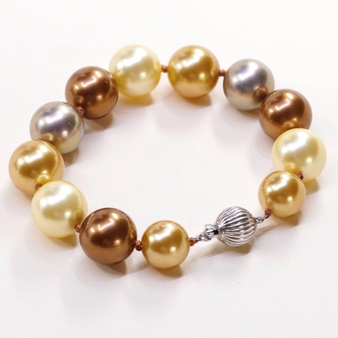 6.5”, Vintage handmade bracelet, gold and earth tone pearl beads w/ 925 clasp