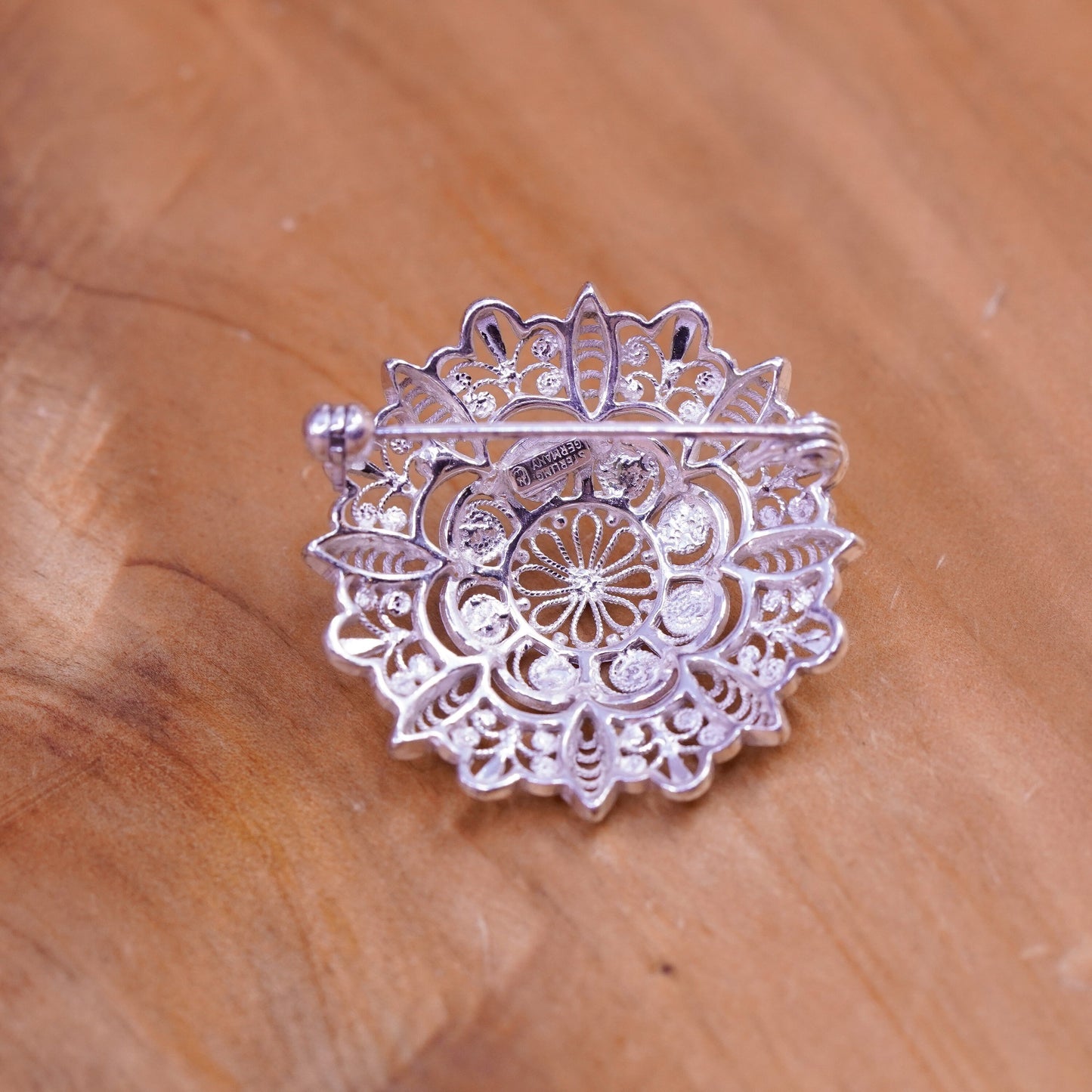 Vintage handmade sterling silver round shaped filigree floral brooch