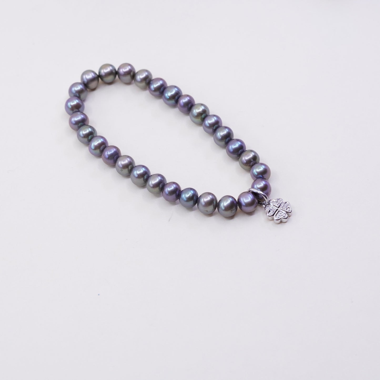 7”, bracelet, black pearl with elastic band and 925 silver lucky clover charm,