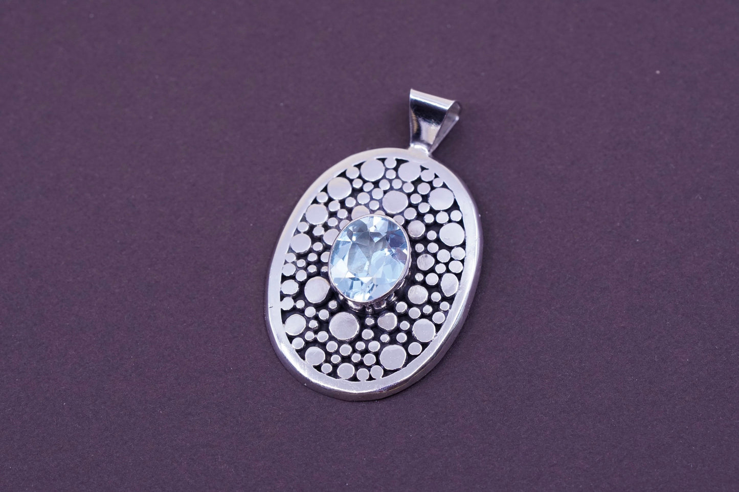 vtg Sterling silver handmade pendant, 925 pebble textured oval with blue topaz