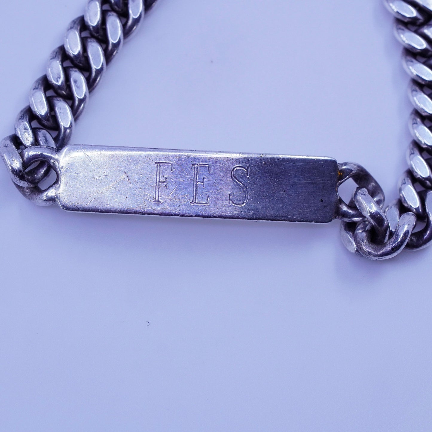 7.5”, doskow Sterling silver bracelet, 925 curb chain name tag engraved “FES”