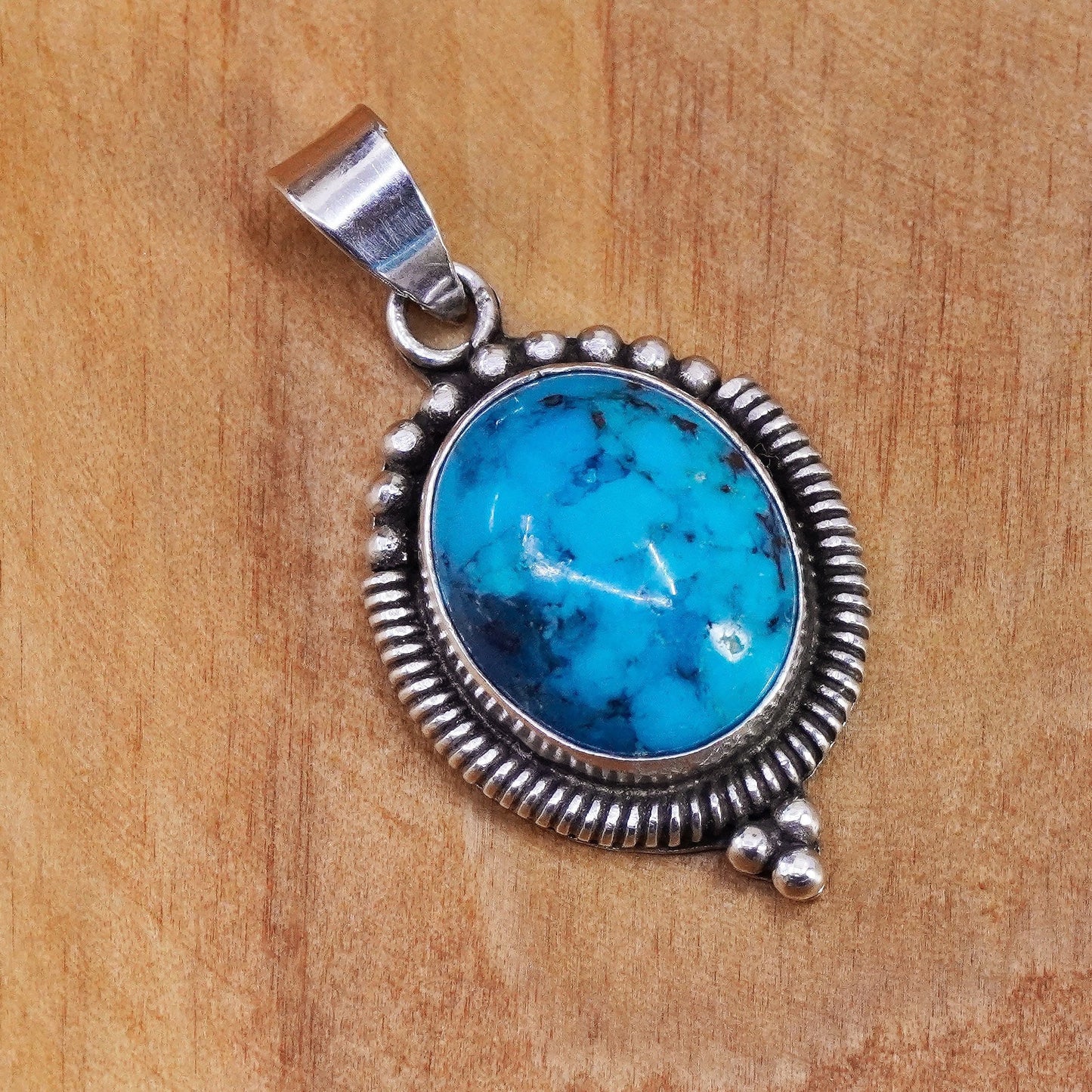 vtg Sterling silver handmade pendant with oval kingman spiderwebbed turquoise