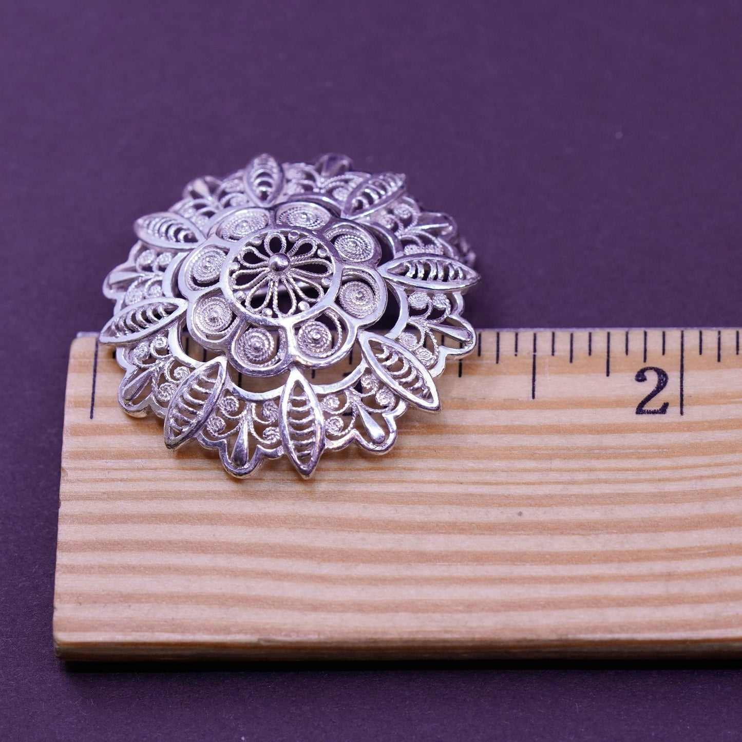 Vintage handmade sterling silver round shaped filigree floral brooch