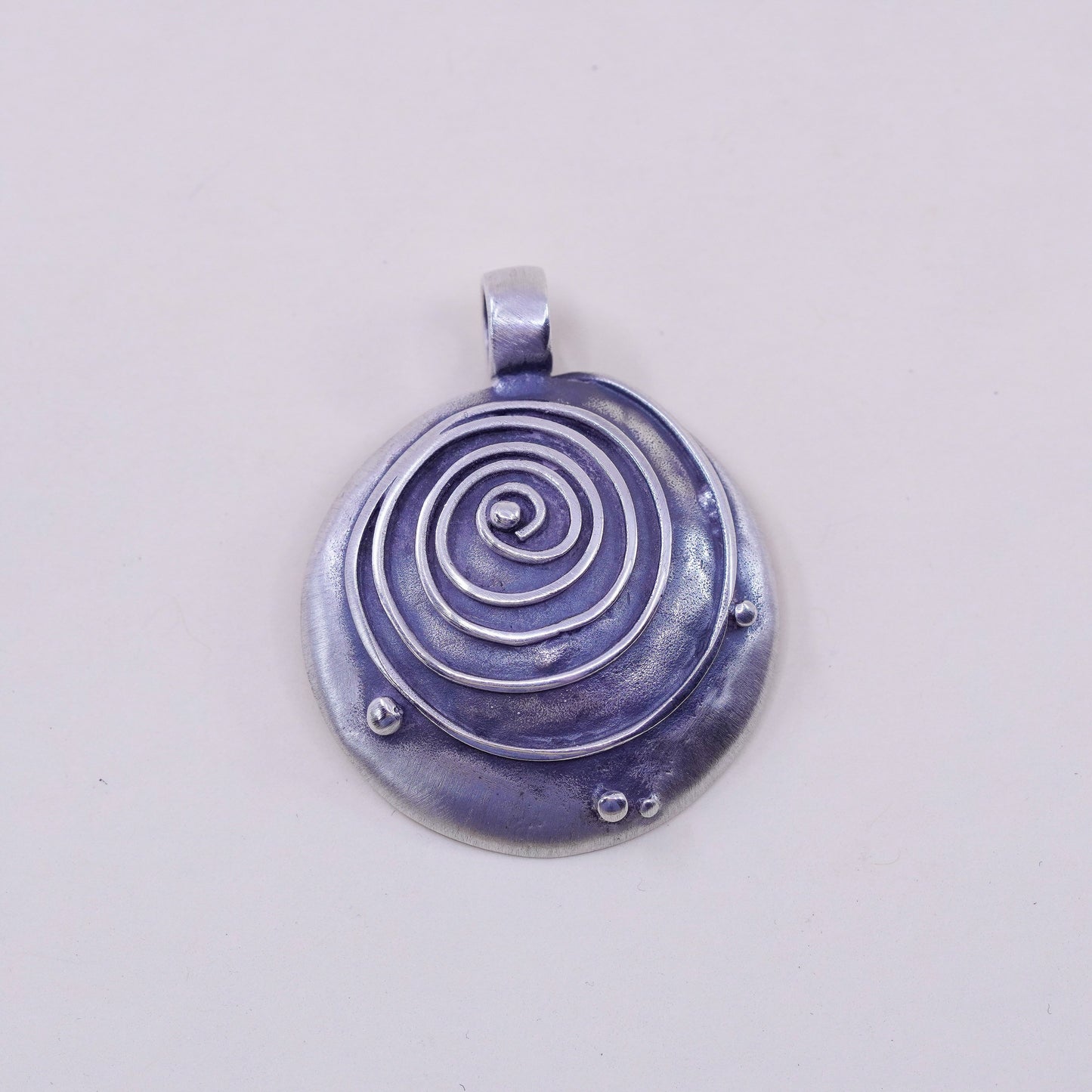 Vintage sterling 925 silver handmade hammered pendant with wave swirl embossed