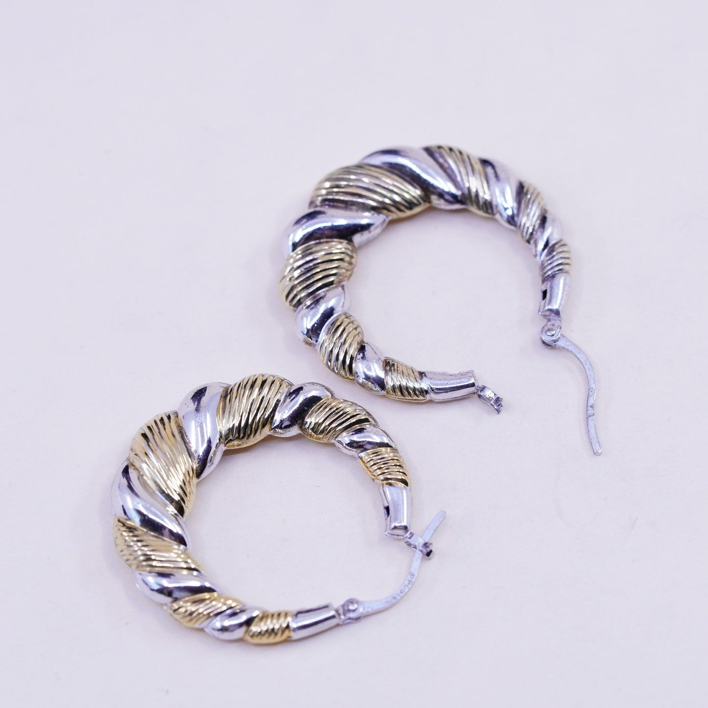 1.25”, two tone sterling silver loop earrings, Ribbed twisted hoops, huggie