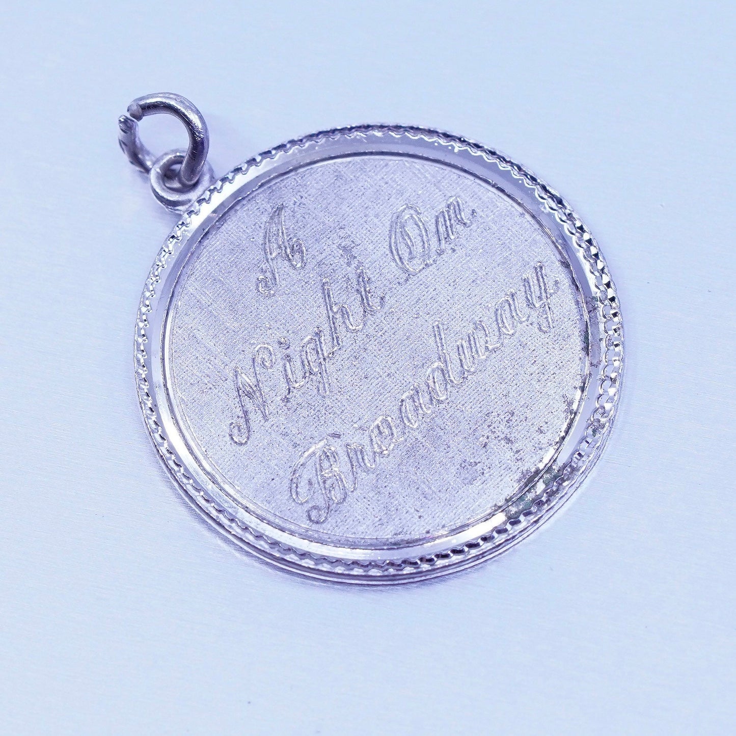 antique Beau sterling 925 silver “a night on Broadway” tag pendant