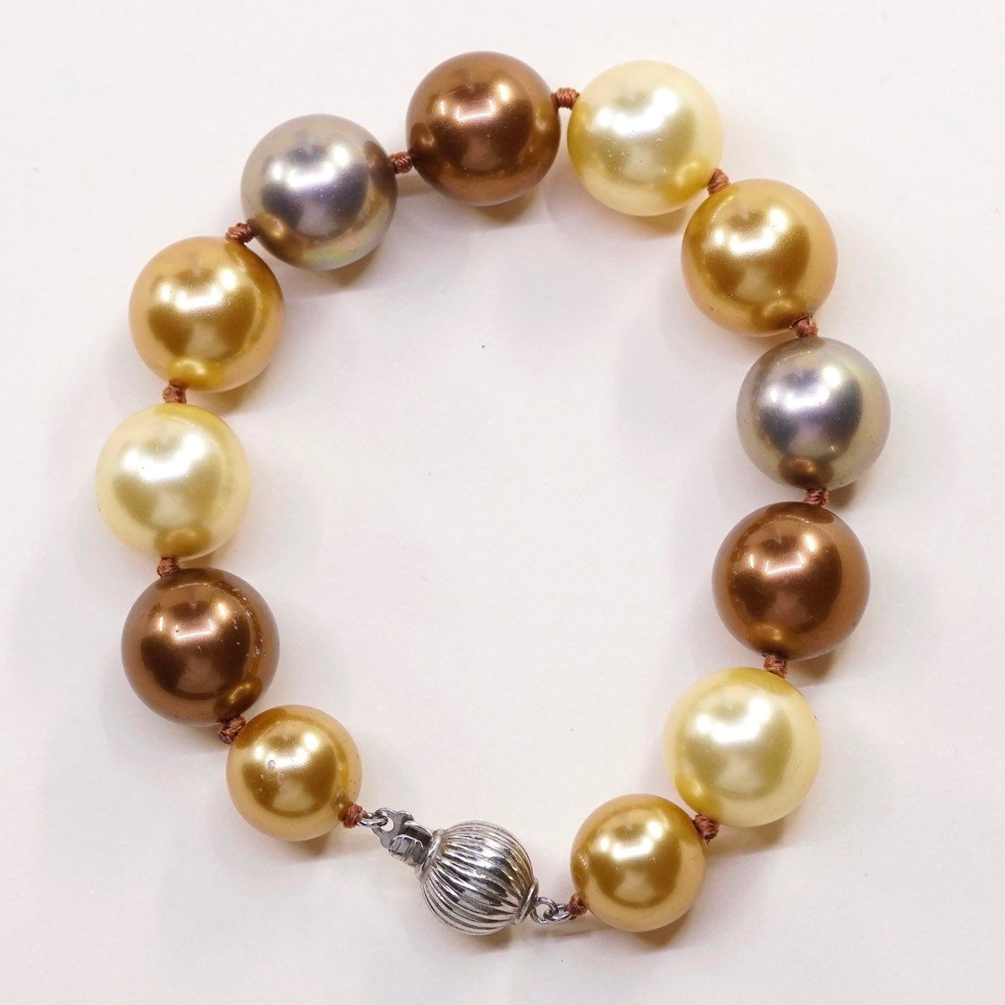 6.5”, Vintage handmade bracelet, gold and earth tone pearl beads w/ 925 clasp
