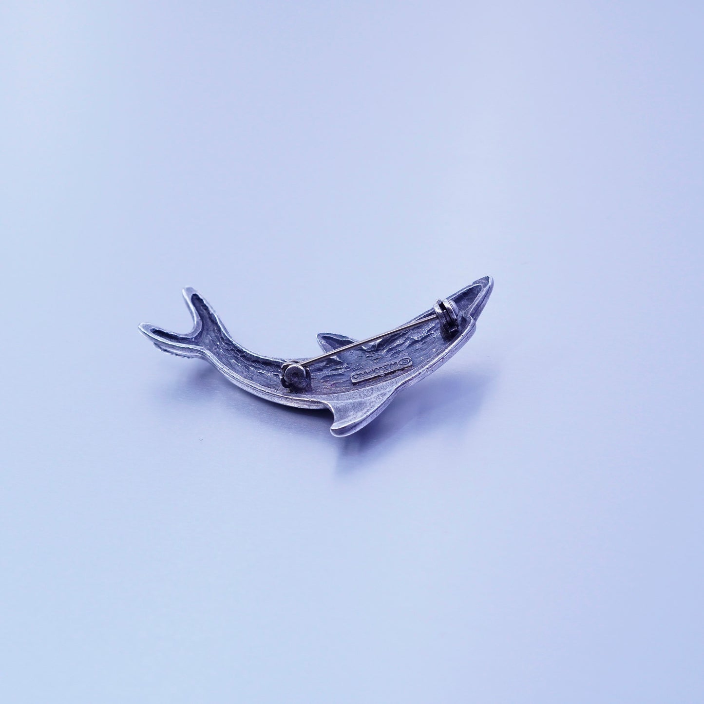 Vintage newpro silver tone dolphin brooch with blue eye