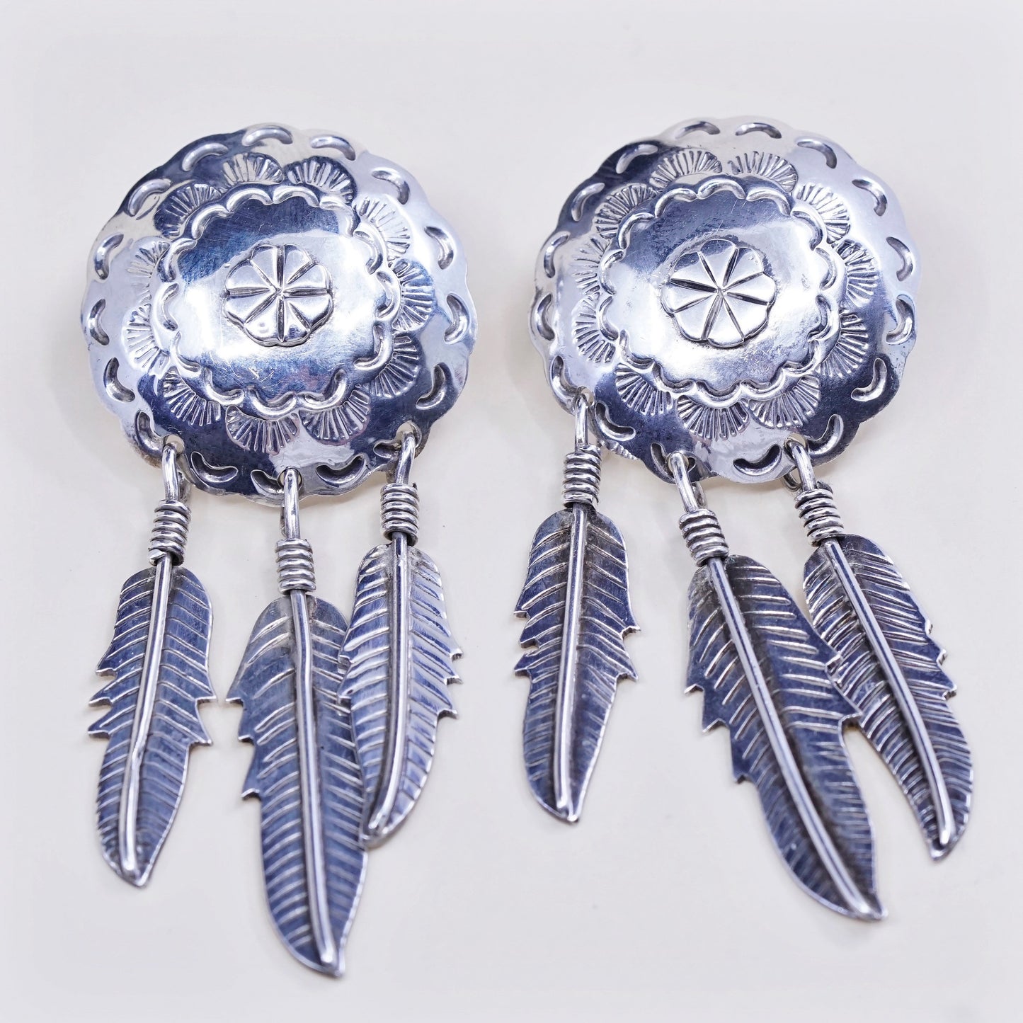 Vintage southwestern Sterling silver handmade disc earrings with feather