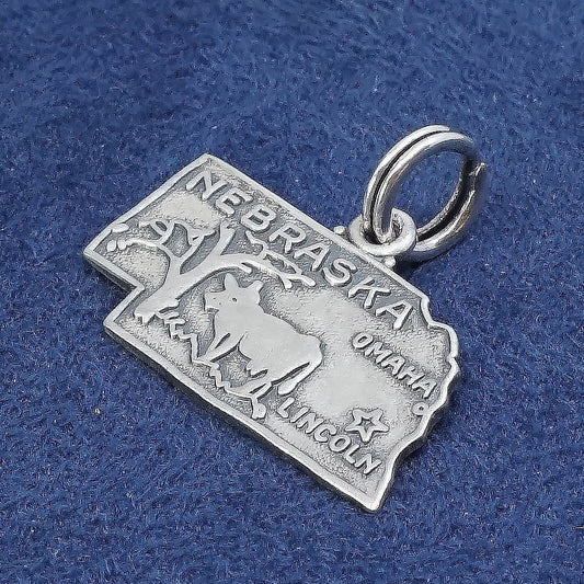 vtg sterling silver handmade pendant, 925 Nebraska state tag charm