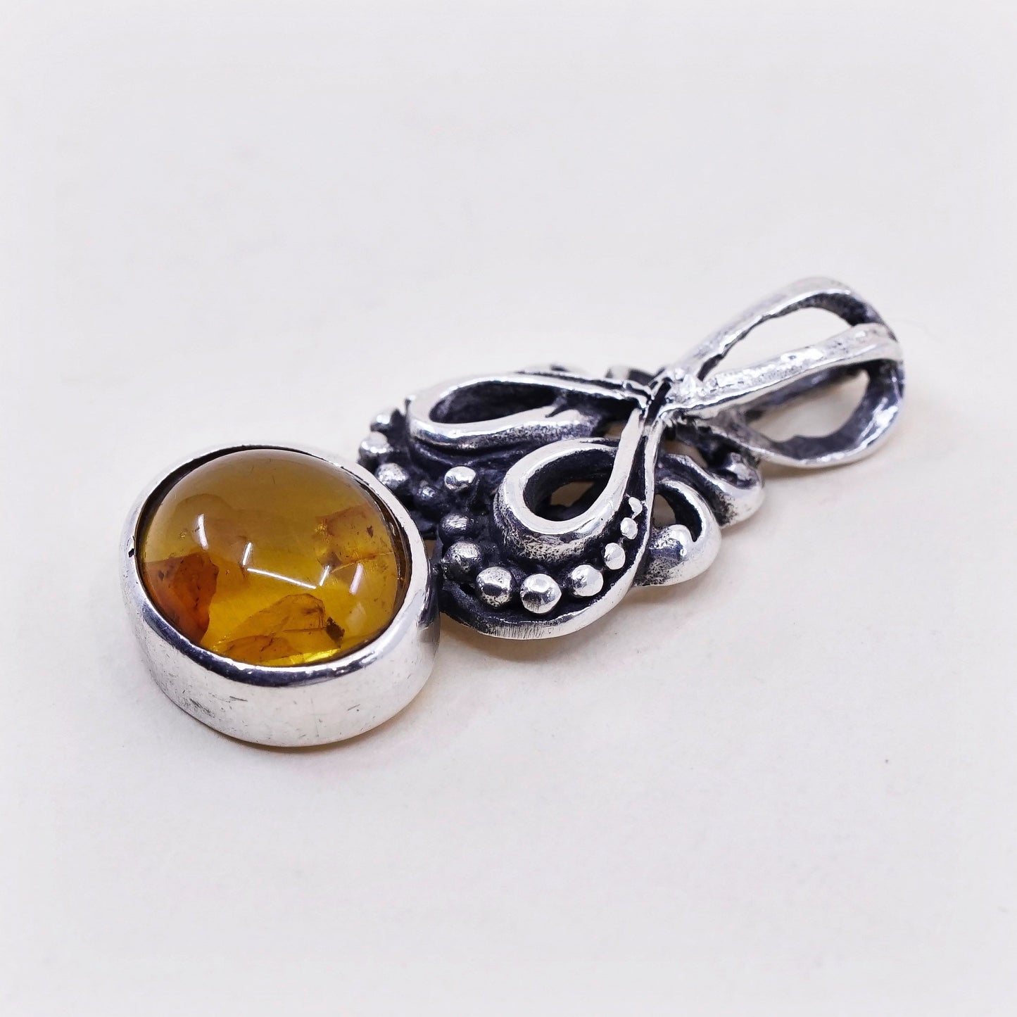 Vintage sterling 925 silver handmade pendant with oval amber and beads around
